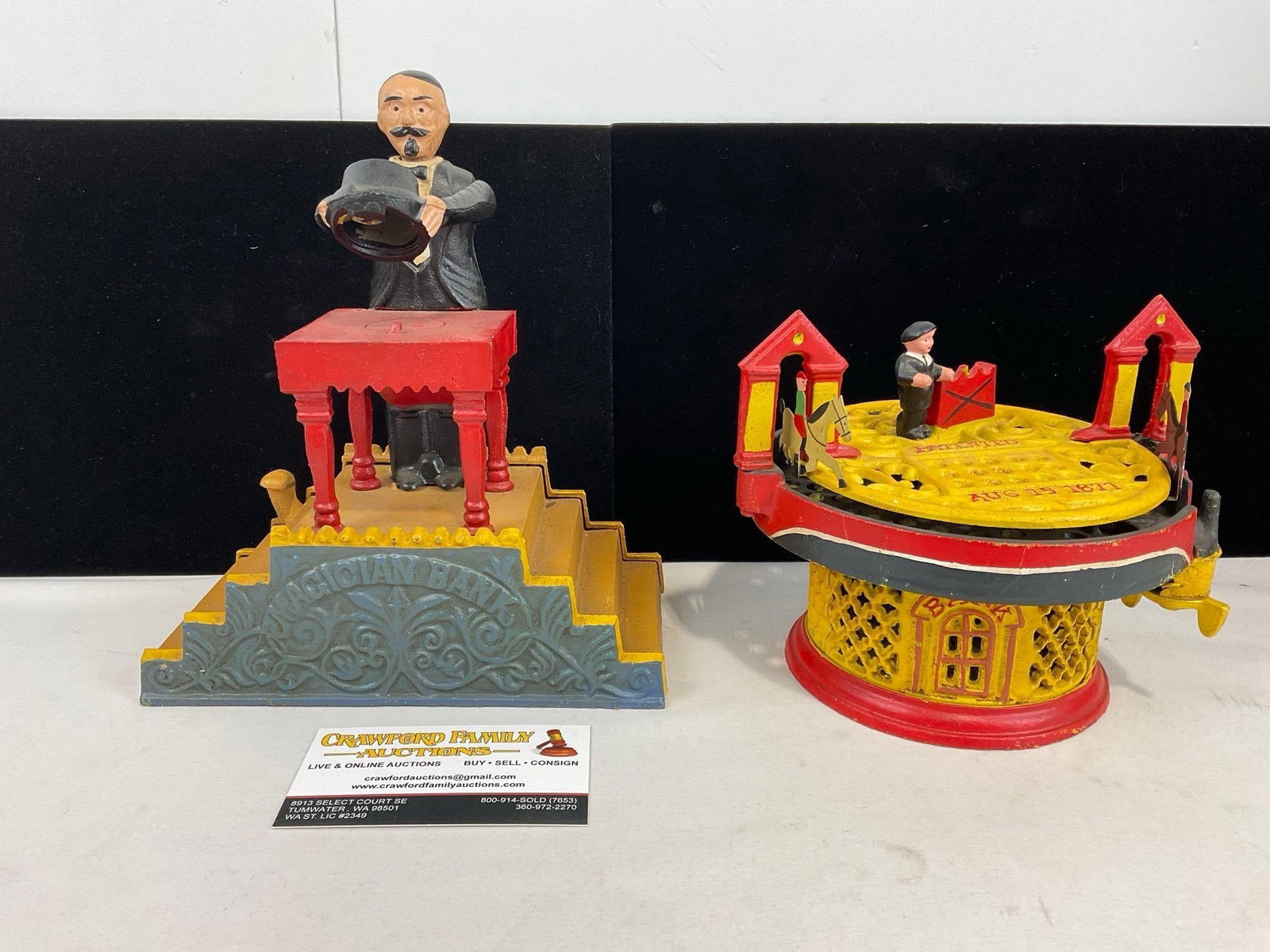 Pair of Repro Cast Iron Antique Coin Banks, Magician Bank & Racing Horses, Bright Red & Yellow: Appears to be in good shape. The pieces together measures approx 9h x 13w x 7d inches. See pics. E-5360