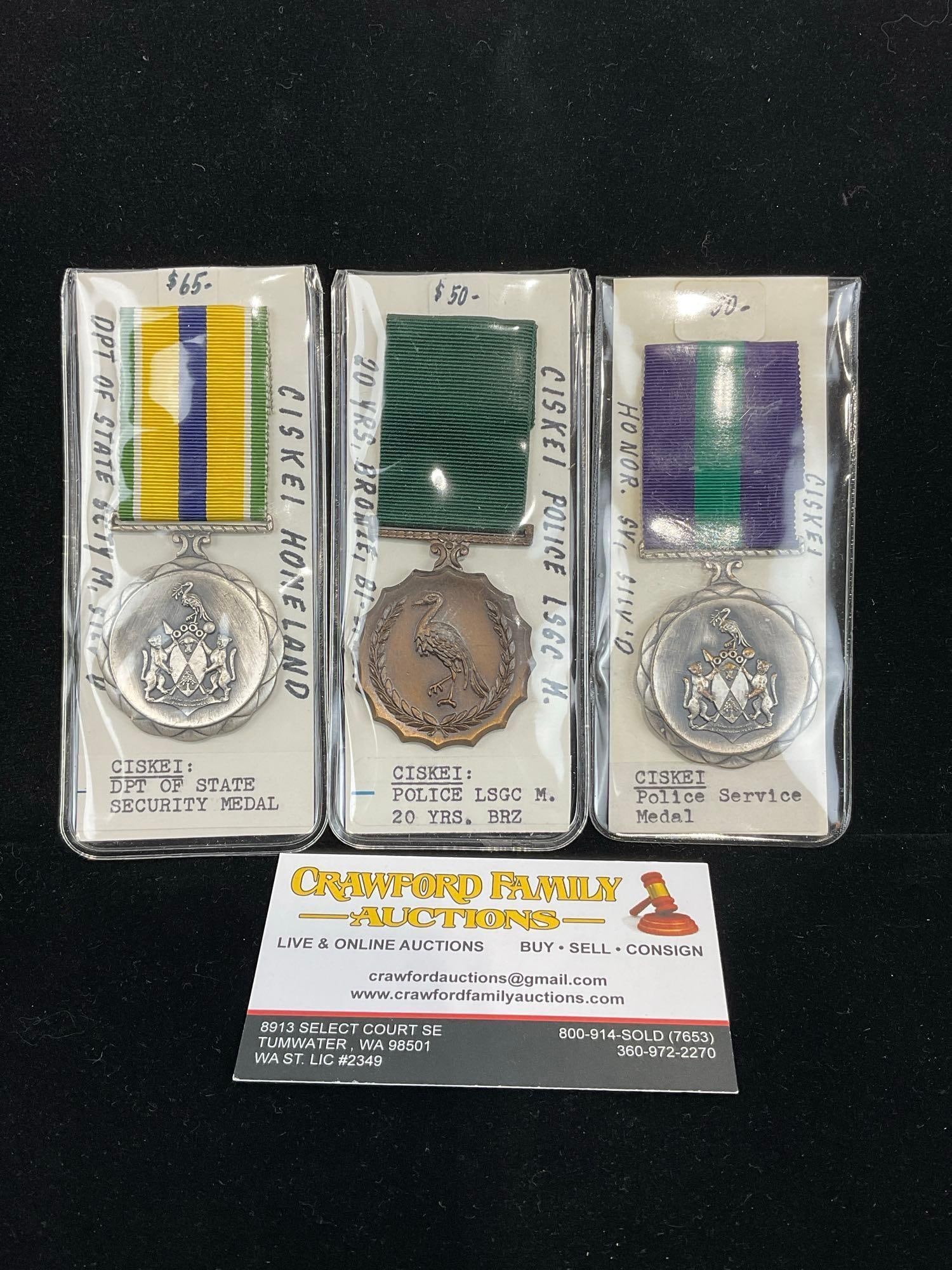 3 Ciskei Medals, 2 Police Long Service, 1 20 Years Bronze, DPT of State Security Medal: All from a single collection, these are briefly described on the tag and were kept in a display. They measure approx 6h x 3w x 2d inches. See pics. E-5300