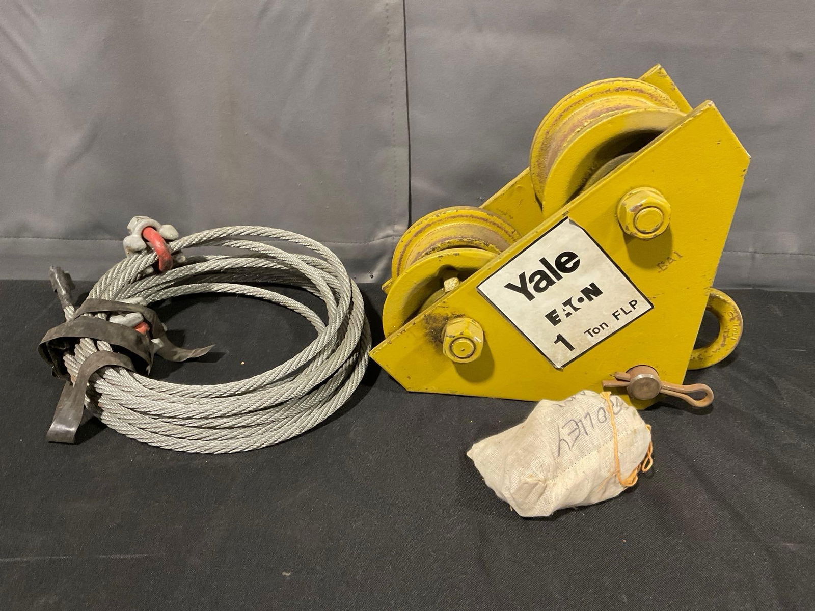 Yale Eaton 1 Ton FLP Heavy Duty Push Beam Trolley, Coiled Length of Steel Cable: Appears to be in fair to good shape. The piece measures approx 10h x 13w x 11d inches. See pics. E-5180 *No in-house shipping, due to size and weight*