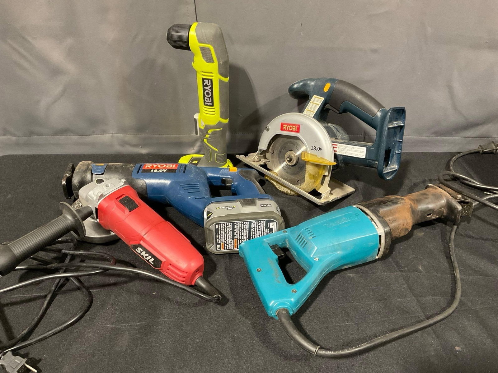 3 Ryobi Tools, Screwdriver, Rec Saw, Saw & Battery, Skil Angle Grinder & Makita Recipro Saw JR3000V: All tested and working, the Ryobi battery works with all three tools. Appears to be in fair to good shape. The piece measures approx 12h x 18w x 14d inches. See pics. E-5180 *No in-house shi