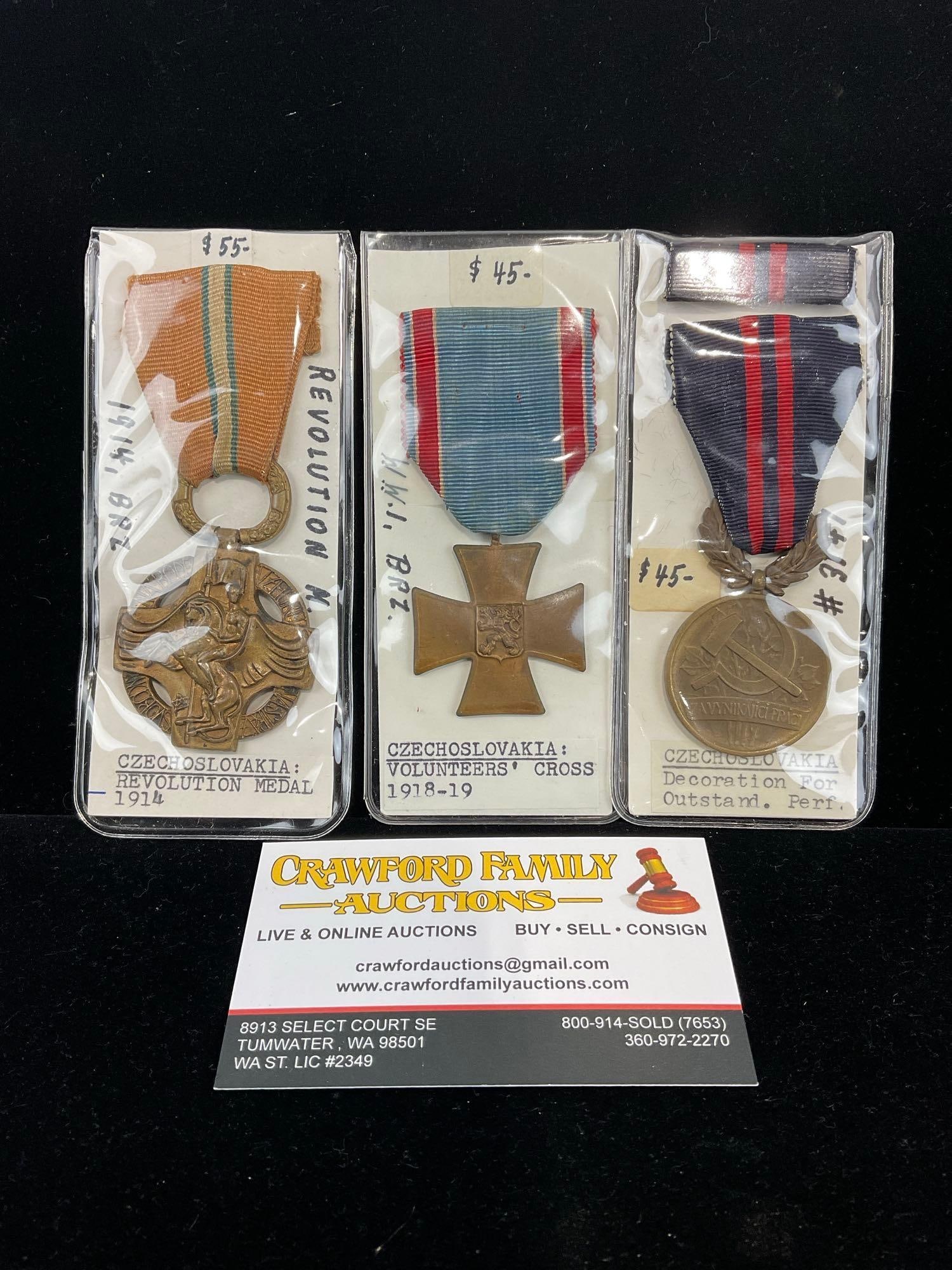 3 Czechoslovakian Medals, Revolution 1914, Volunteers Cross 1918-19 & Decor. for Outstanding Perf.: All from a single collection, these are briefly described on the tag and were kept in a display. They measure approx 6h x 3w x 2d inches. See pics. E-5300