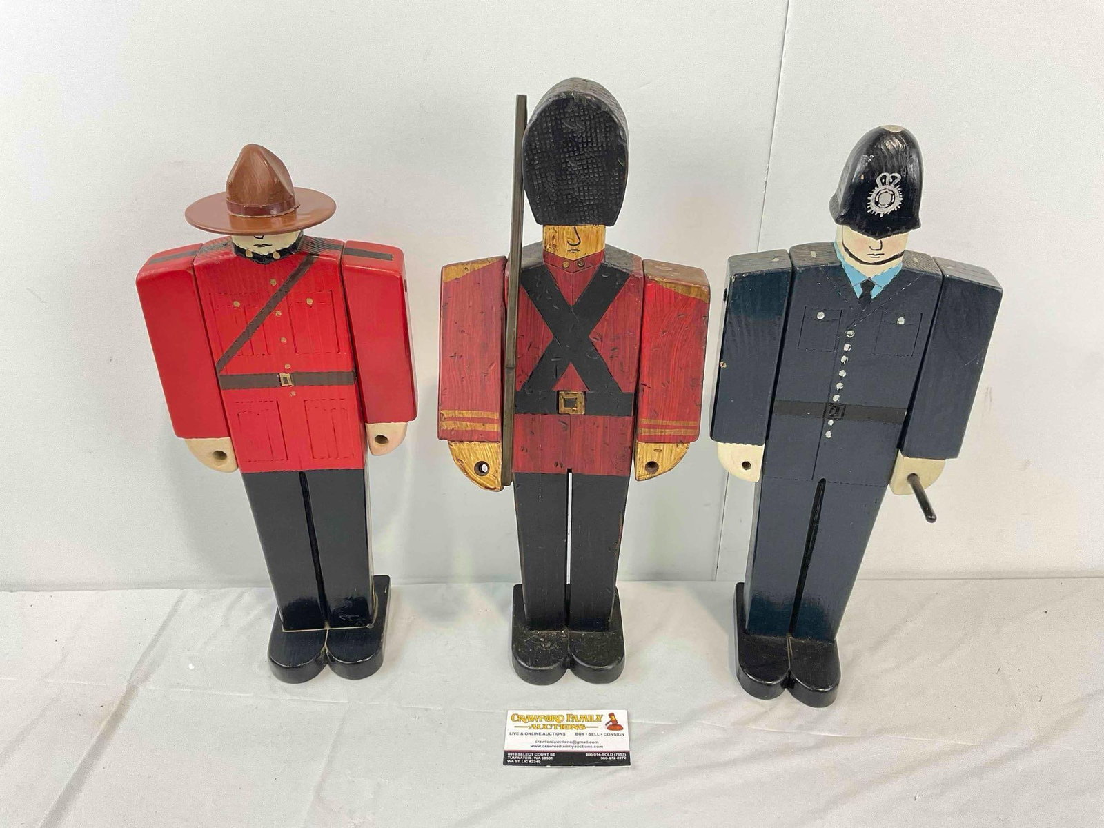 3 pcs Vintage Handmade Wooden Toy Soldiers, incl. Mountie, British Police & Queen's Guard.: 3 pcs Vintage Handmade Wooden Toy Soldiers, incl. Mountie, British Police & Queen's Guard. Minor wear indicative of age, signed on bottom, condition is otherwise very good. Largest measures 7" x 3