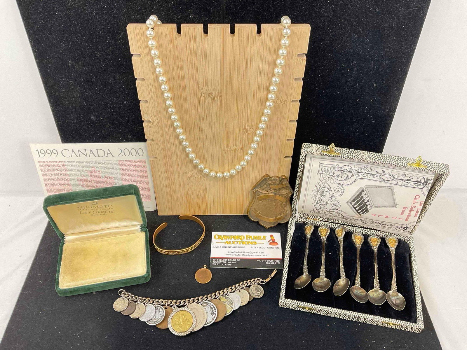 Group group of collectibles, bracelet made of foreign coins, 1883 Indian head penny pendant plus: C 5010 Brass badge. 2012 American Indian relief council reproduction coin in A bezel. Sabona London, gold tone cup bracelet Vintage Italian Demitasse spoon set original case from around the world shop