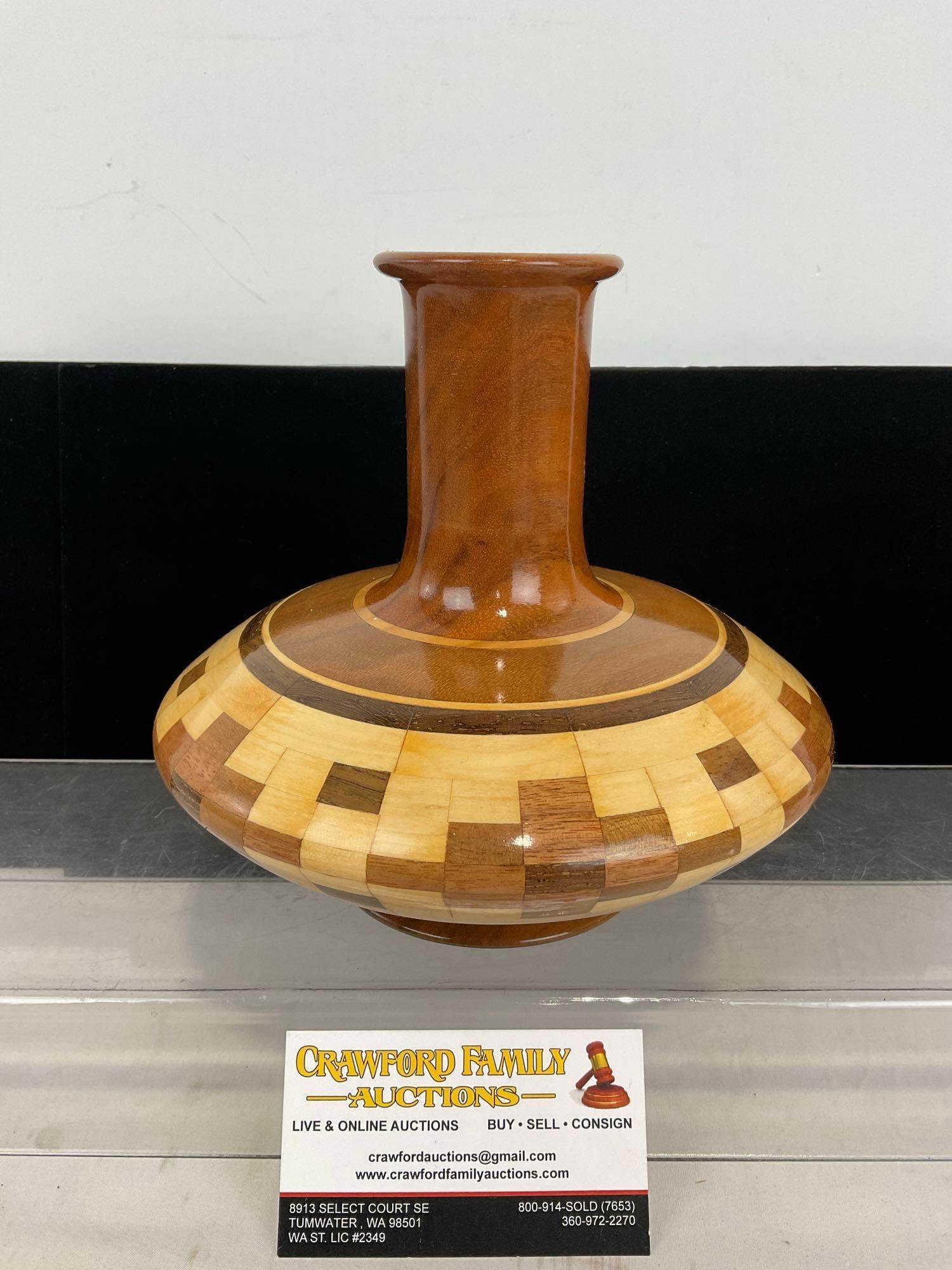 Signed Native American Pattern Wooden Vase, Artistry in Wood, 8h x 8w x 8d inches, variety of woods: Previously listed for 150 dollars. Signed by Artistry in Wood, J.W. Clem. Similar to the next, just taller and thinner. Comes with a pamphlet of some of the woods included to make this piece. Appears