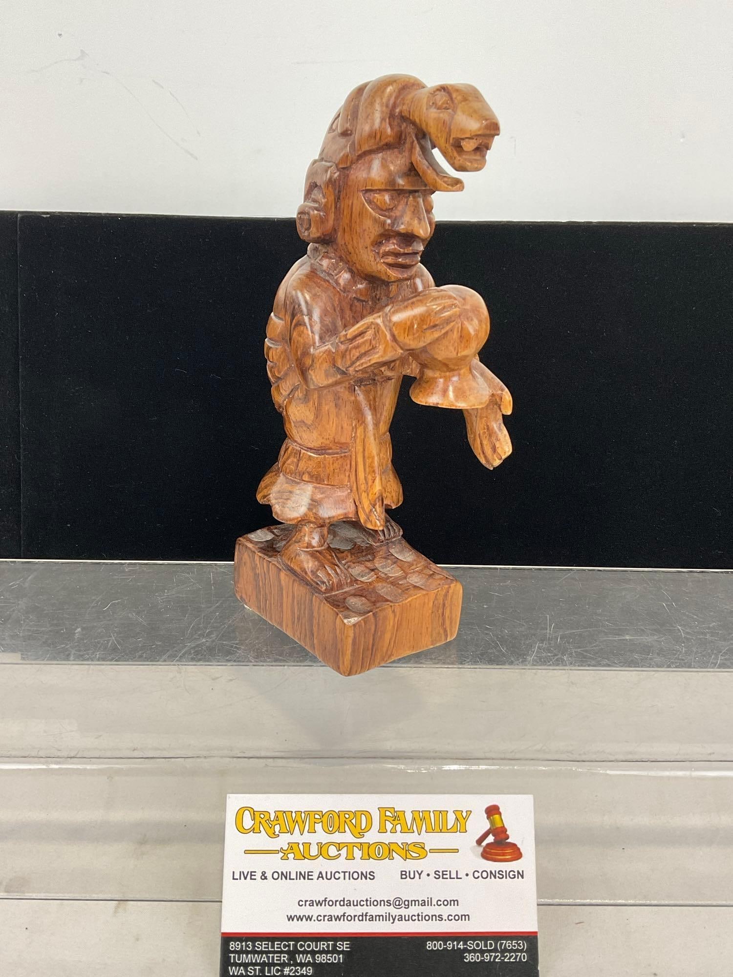 Handcarved Wooden Statue of the Mayan Moon Goddess Ixchel, 8h x 5w x 4d inches: Signed Manuel on the bottom of the piece. Appears to be in good shape. The piece measures approx 8h x 5w x 4d inches. See pics. E-5320 