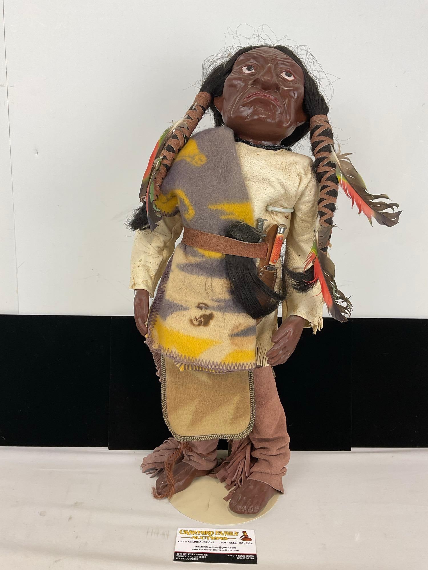 Native American Warrior Doll W/ wool Blanket, Leather Details, Braided horse hair & Bowie knife: Vintage Native American made Looks to be a vinyl or toughened leather face on top of wood base. Warrior has leather belt with horse hair simulated scalp tucked it it W/ a miniature Bowie knife. Seems
