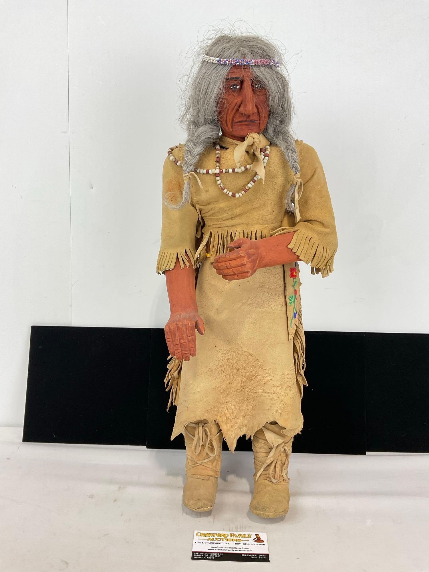 Native American Hand Carved Wooden Doll W/Fringe Buckskin Dress, Beaded head band Signed Erla Gra...: Created by Nationally Acclaimed Artist Erla Graham And signed on the Back of the neck Nicely Detailed Vintage SW Native American Older woman featuring Fringe Buckskin dress carrying A bundle of f