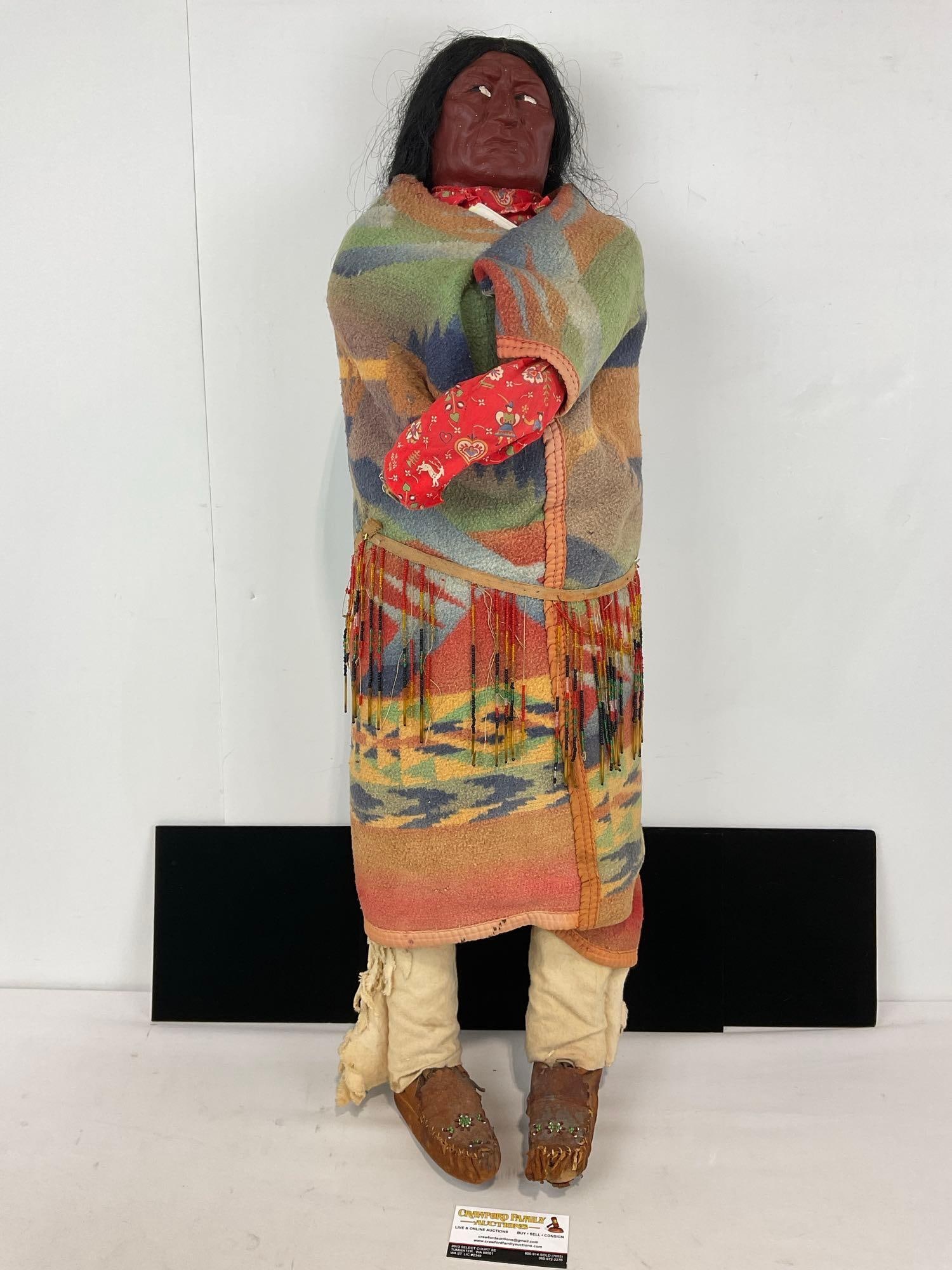 Vintage Native American Doll, Multicolor Blanket, 36h x 11w x 11d in, handbeaded Leather shoes: All hair is Horse or Human. Appears to be in fair to good shape, the shows have some wear. The piece measures approx 36h x 11w x 11d inches. See pics. E-5320 *Oversized shipping may apply*