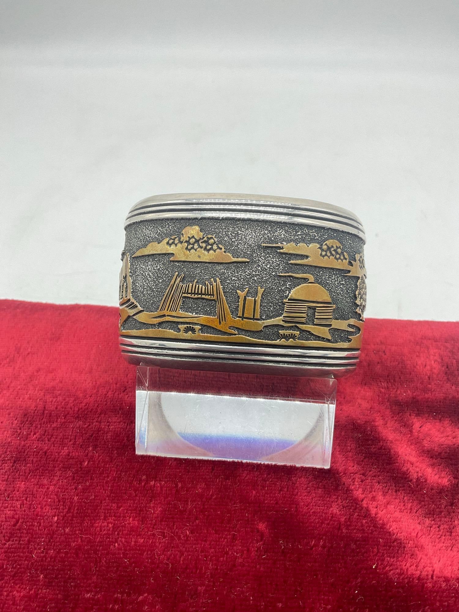 Sterling Silver Story Teller Cuff Bracelet Signed By Famous Navajo Silversmith Thomas Singer: C-5320 Amazing piece of Jewelry By World renowned Navajo Silversmith Thomas Singer (1940 May 31, 2014) Cuff is 65.93 grams 1 3/4" wide x 2.5" see pics 