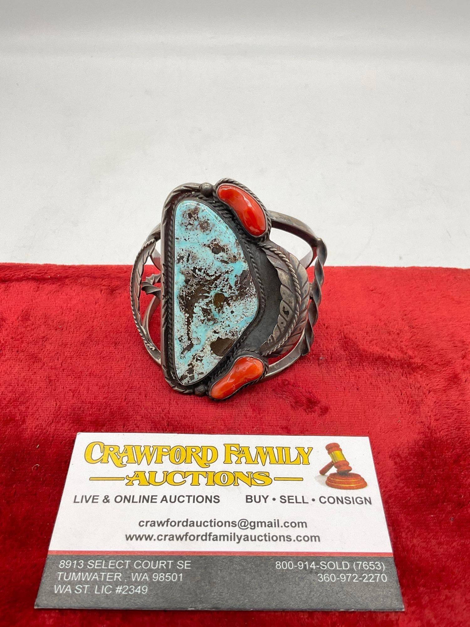 Masterwork Navajo Native American sterling silver bracelet with turquoise and coral - 81.2grams: Approx 3x2.5", 81.2 grams or 2.867 ounces ttw, and has about a 1.5"opening at the tightest point. Matches the previous lot. Appears to be Signed Tigur but unsure if that is the maker as the other piec