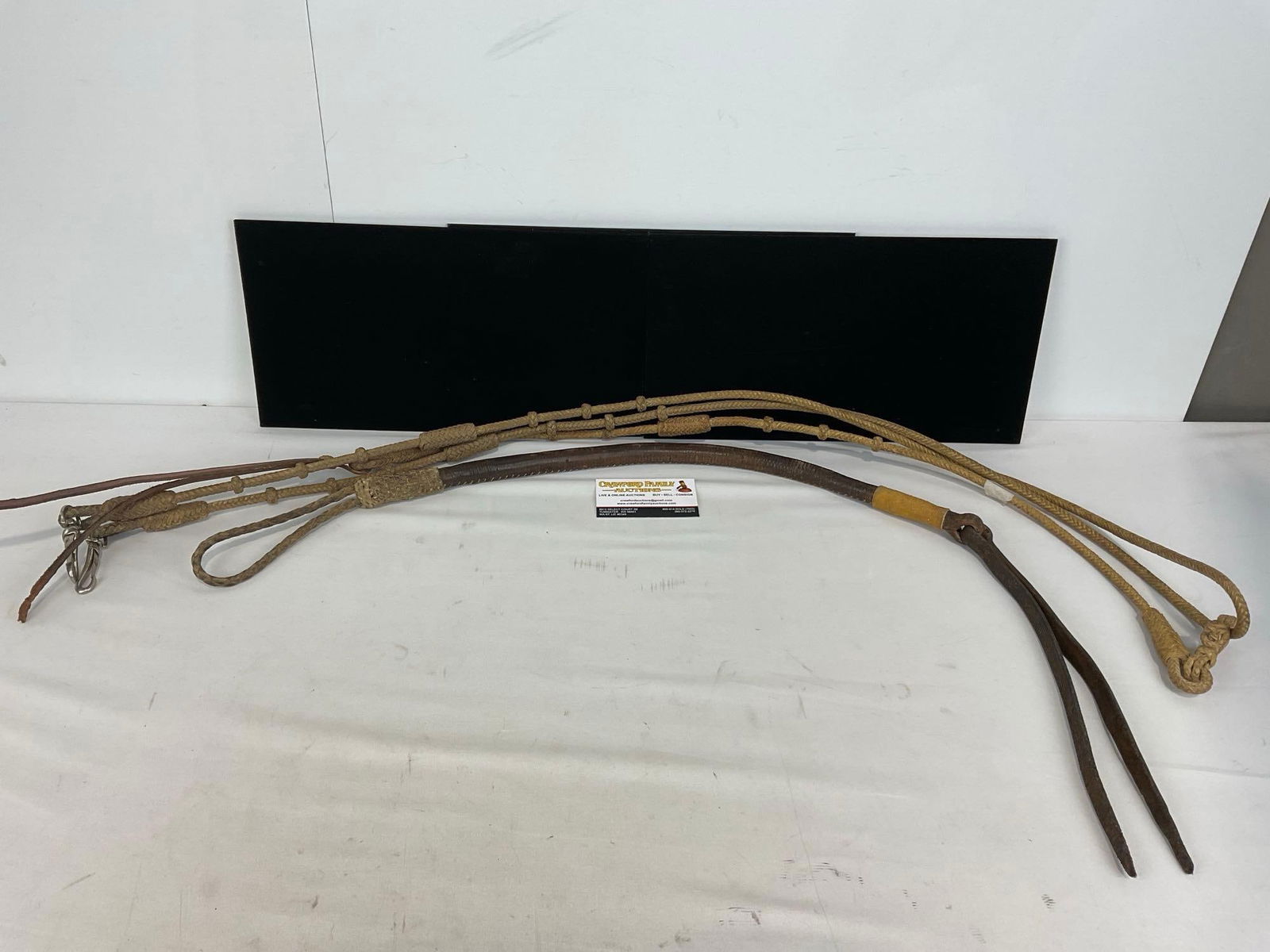 Early 20th Century, 1900-1915 Rawhide Reins & 1920s Riding Crop Quirt, Finely Braided, Handmade: Appears to be in good shape for the age of the pieces. The piece measures approx 35h x 5w x 5d inches. See pics. E-5290 