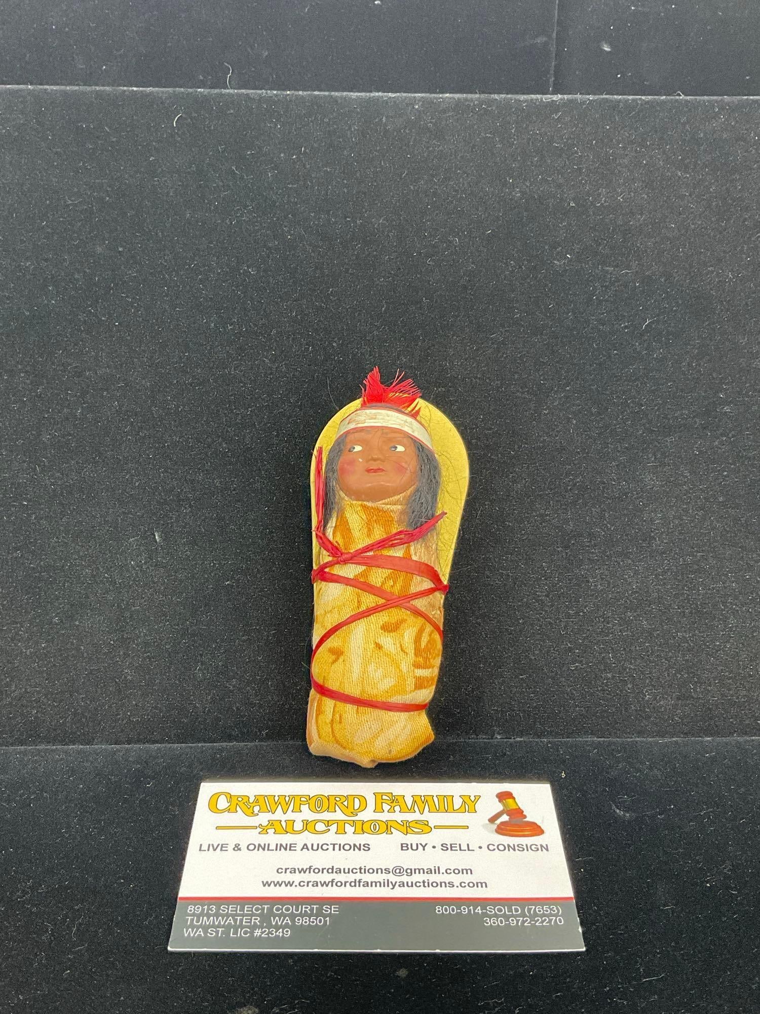 Early 20th Century Native American Papoose doll, 5h x 3w x 3d inches: Signed on the back, Pat Stevens March 3 1946 Provo Utah. Appears to be in good shape. The piece measures approx inches. See pics. E-5320