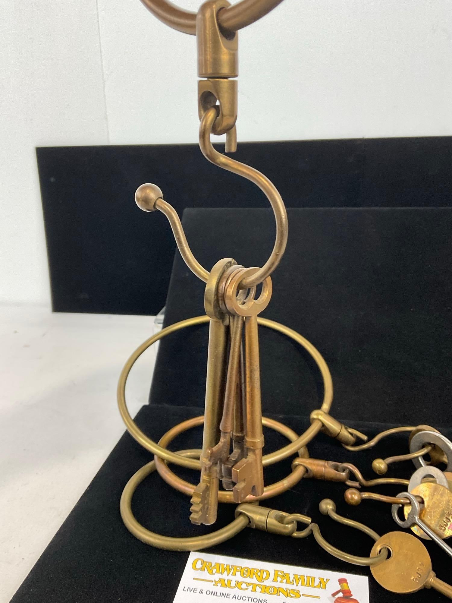 Collection of 11 Skeleton Keys on 4 Brass Rings, Articulated Rings, 9h x 7w x 3d inches - 2