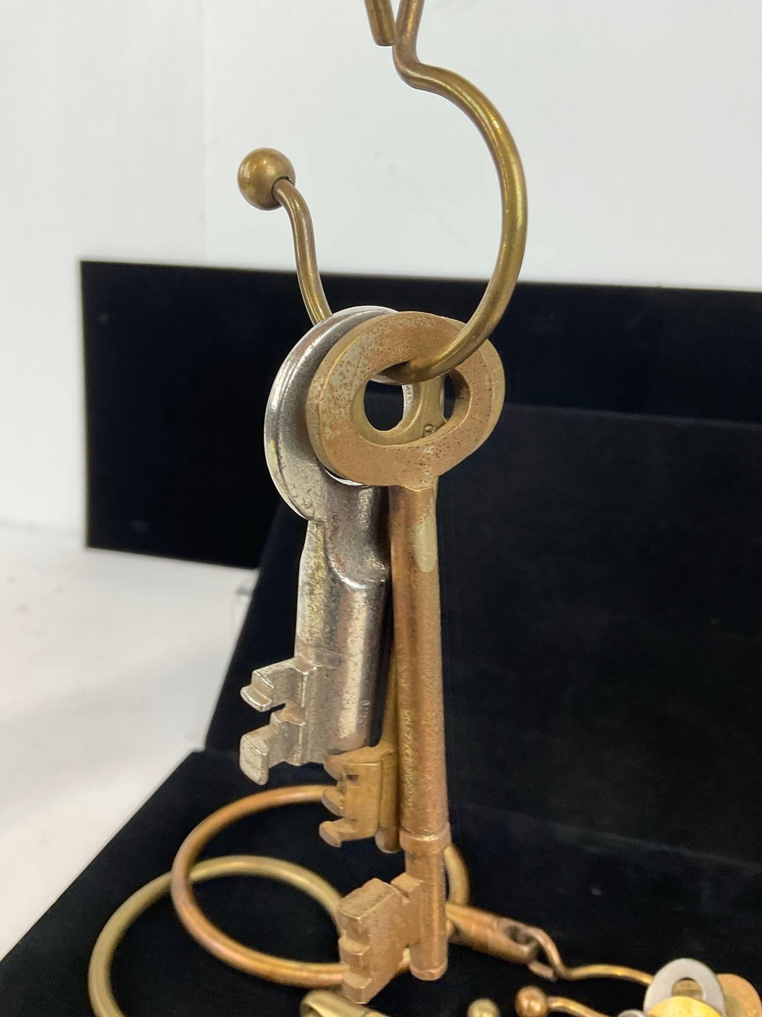 Collection of 11 Skeleton Keys on 4 Brass Rings, Articulated Rings, 9h x 7w x 3d inches - 3