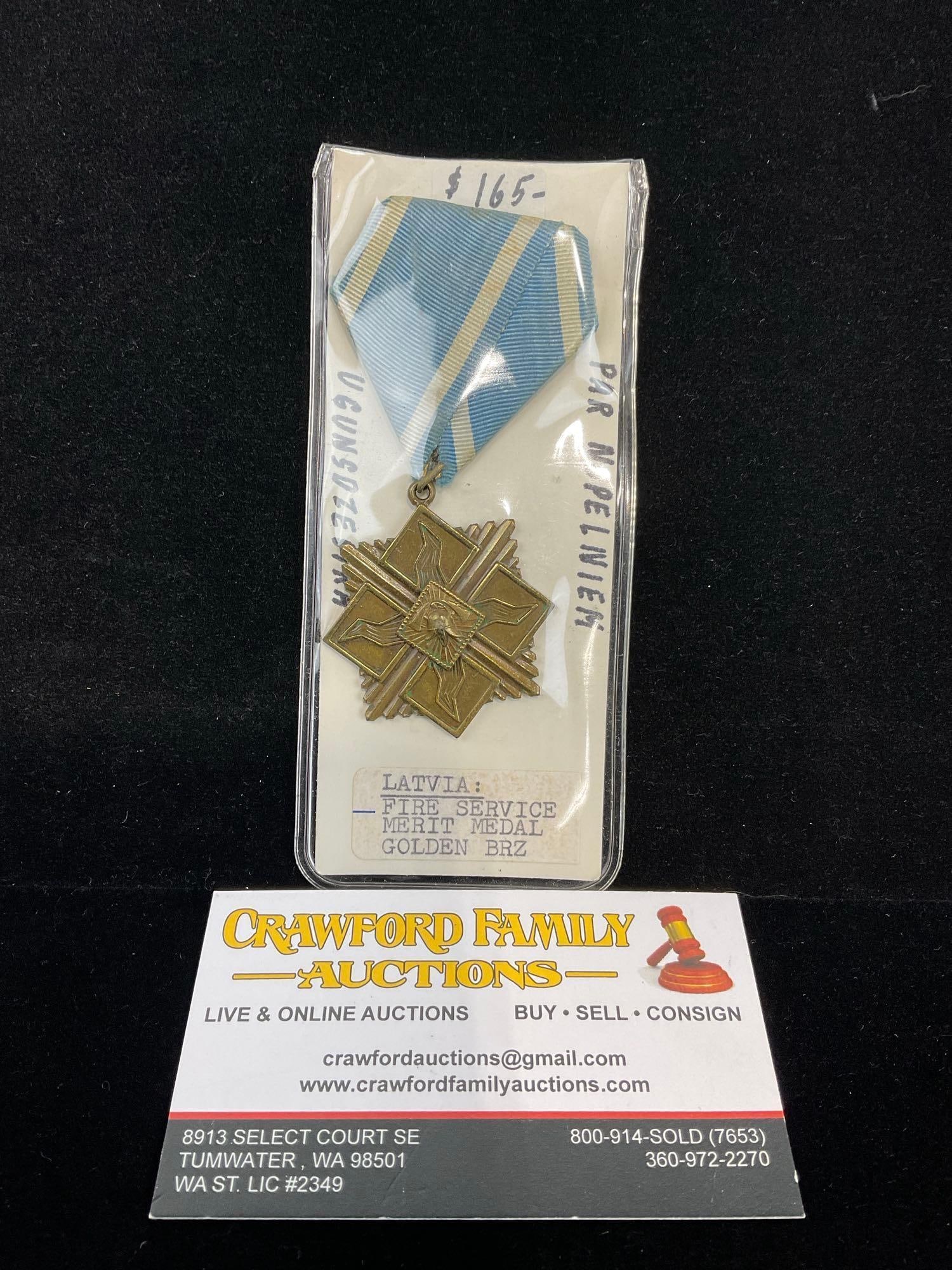 Antique 1920s-30s Latvia Fire Service Merit Medal Golden/Bronze, Blue/White Ribbon: All from a single collection, these are briefly described on the tag and were kept in a display. They measure approx 6h x 3w x 2d inches. See pics. E-5300 
