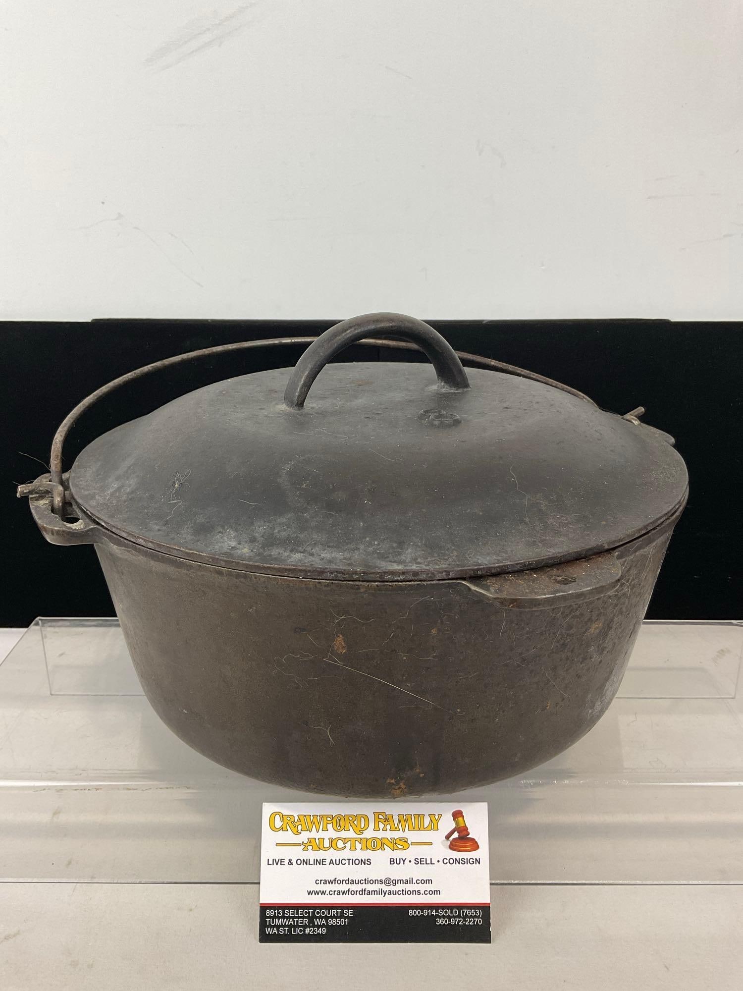 Vintage Cast Iron Dutch Oven w/ Lid & Bail Handle, 8h x 13w x 12d inches: Appears to be in good shape, some wear, and some rough finish. The piece measures approx 8h x 13w x 12d inches. See pics. E-4880 