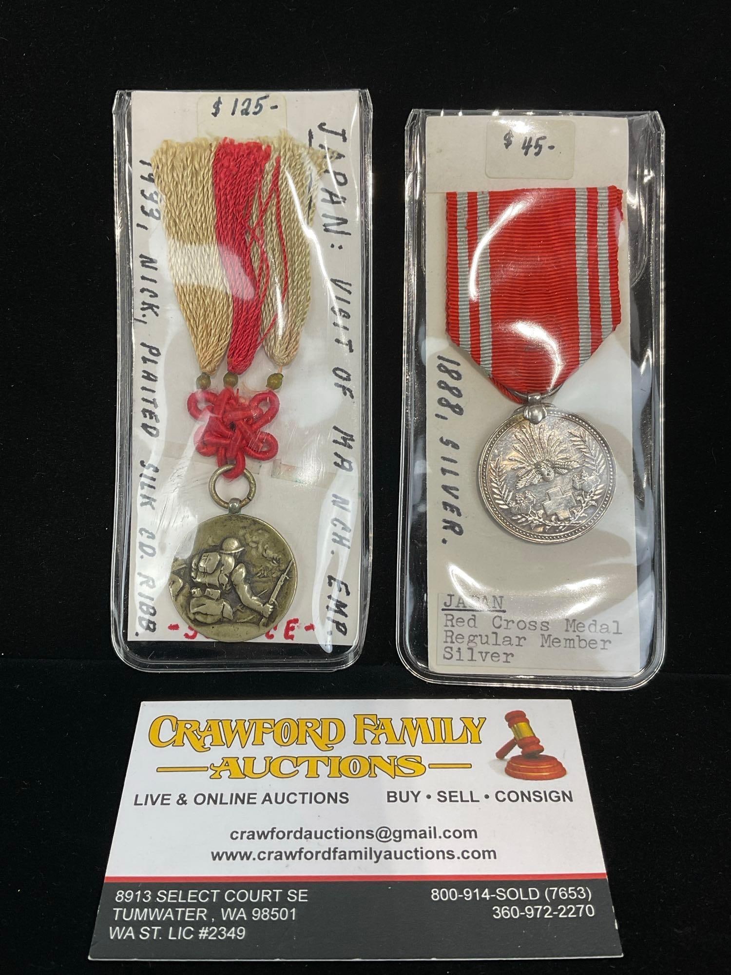 Pair of Japanese Medals, 1933 Visit of Manchu Emp. & 1888 Red Cross Medal Regular Member Silver (?): All from a single collection, these are briefly described on the tag and were kept in a display. They measure approx 6h x 3w x 2d inches. See pics. E-5300 