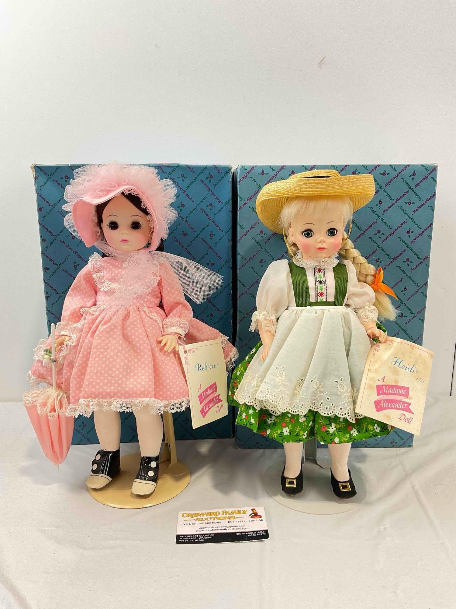 2 pcs Vintage Madame Alexander Porcelain Dolls w/ Original Boxes, 1580 Heidi & 1585 Rebecca.: 2 pcs Vintage Madame Alexander Porcelain Dolls w/ Original Boxes, 1580 Heidi & 1585 Rebecca. Have stands and tags! Minor wear indicative of age, condition is otherwise very good. Measures 8" x
