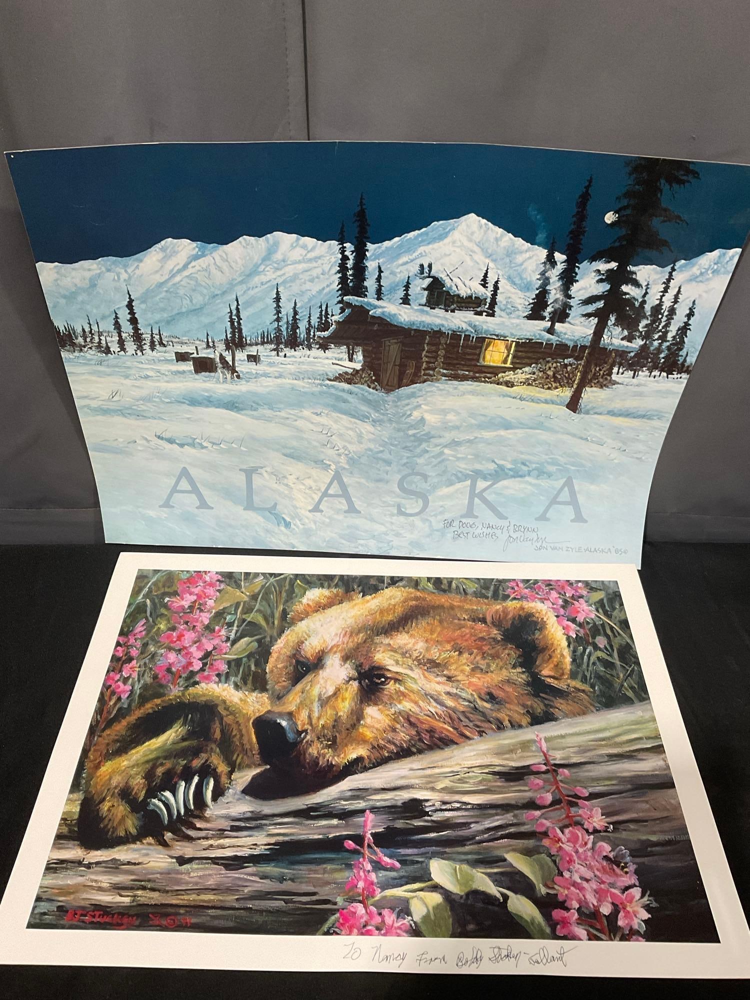 Signed & Personalized Posters, Alaska by Jon Van Zyle & Grizzly Bear by Barbara Stuckey-Gallant: Both are personalized, to Nancy & Doug, Nancy, & Brynn Best Wishes. Appears to be in good shape. The piece measures approx 19h x 25w x 2d inches. See pics. E-4630 