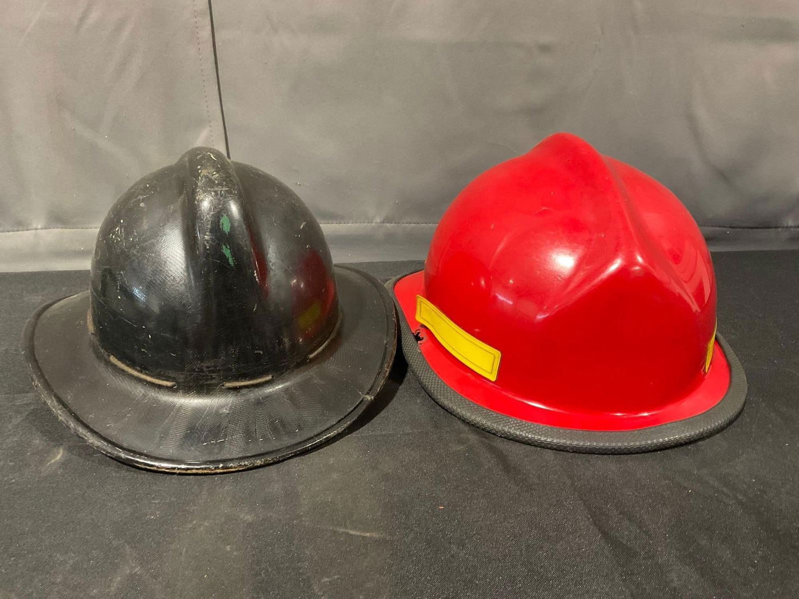 Pair of Hard Boiled Fiberglass Helmets, Mid 20th Century Black & Lynnwood, WA 1980s: Appears to be in good shape. The piece measures approx 12h x 12w x 15d inches. See pics. E-5360 