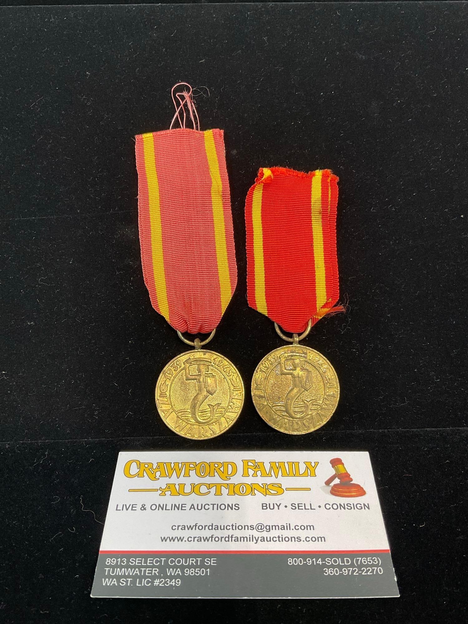 Pair of Polish Medals, Medal for Warsaw 1939-1945, Defense for World War II, Coat of Arms of Warsaw: All from a single collection, these are briefly described on the tag and were kept in a display. They measure approx 6h x 3w x 2d inches. See pics. E-5300 