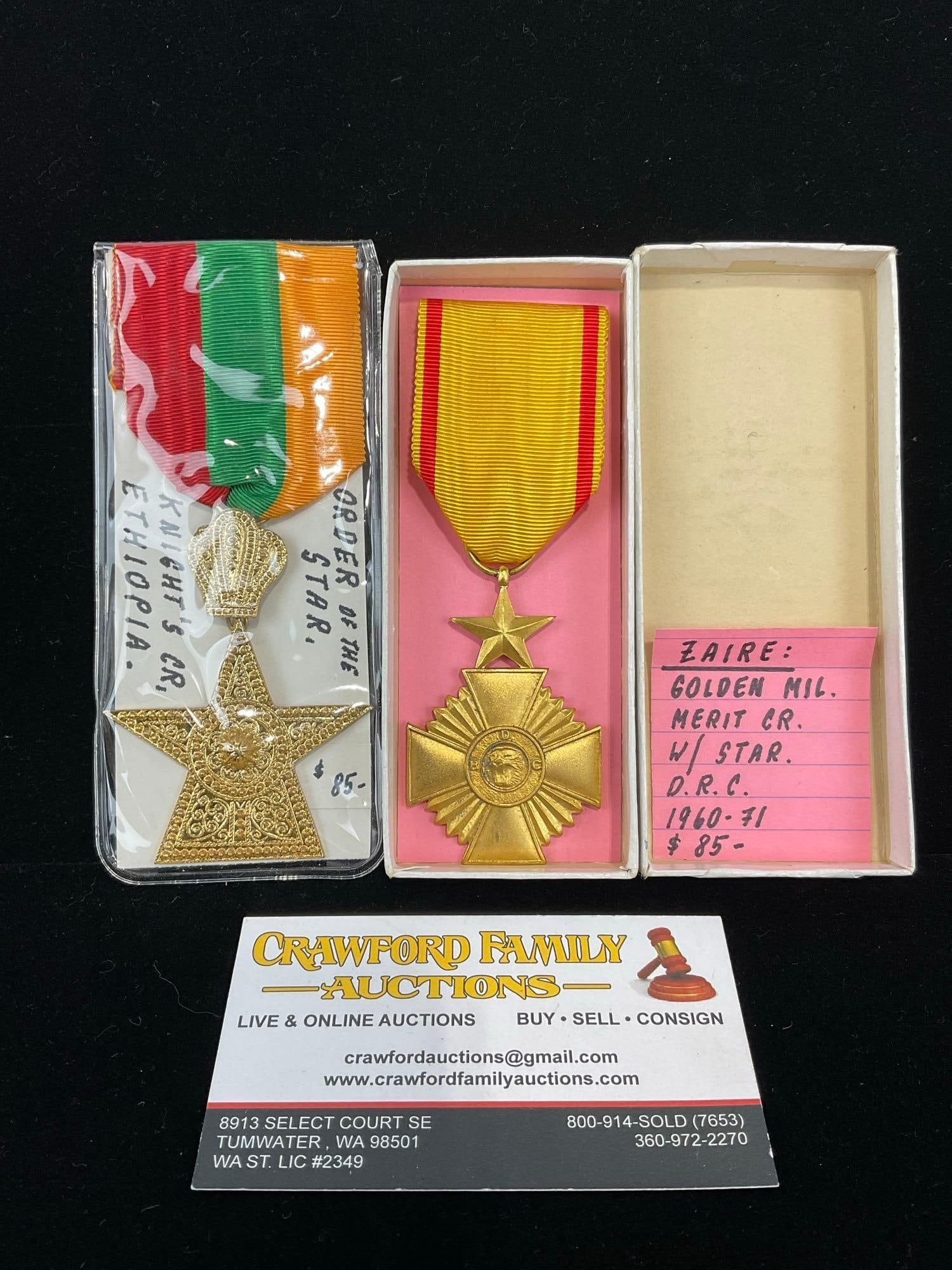 Pair of African Medals, Ethiopian Knights Cross Order of the Star & Zaire Golden Merit Cross: All from a single collection, these are briefly described on the tag and were kept in a display. They measure approx 6h x 3w x 2d inches. See pics. E-5300 