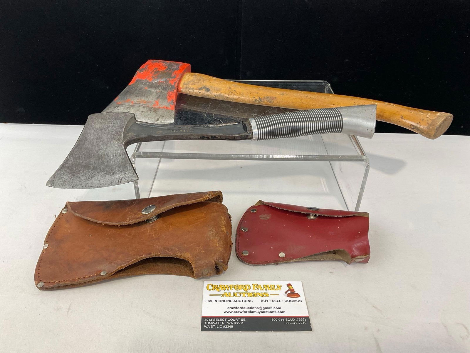 Painted Orange Hatchet w/ Wooden Handle & Western Knives Hatchet w/ Metal Handle, w/ Sheaths: Appears to be in good shape. The piece measures approx 17h x 8w x 4d inches. See pics. E-5360 