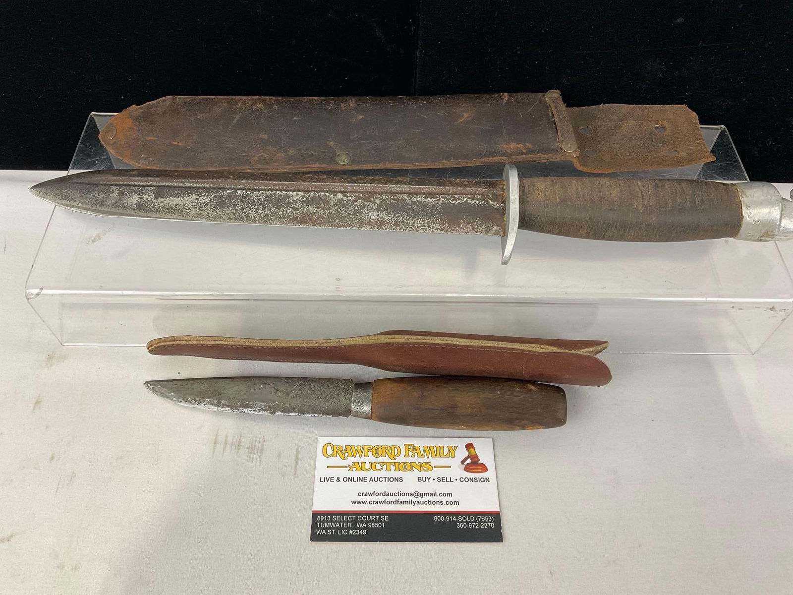 Pair of Primitive Knives, Morakniv Paring Knife & Leather Handle Combat Knife, 13 inch blade: Appears to be in fair used shape. The piece measures approx 18h x 4w x 3d inches. See pics. E-5360 
