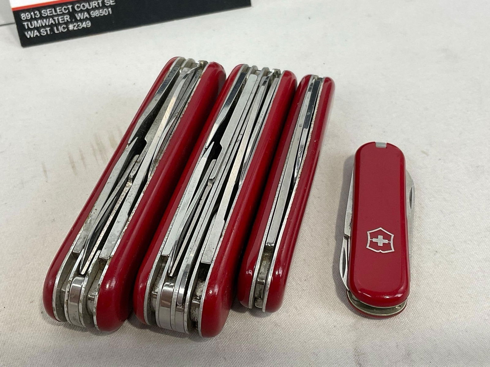 4 Victorinox Swiss Army Knives, 2 Rambler style, Mini Champ, & Huntsman - 3