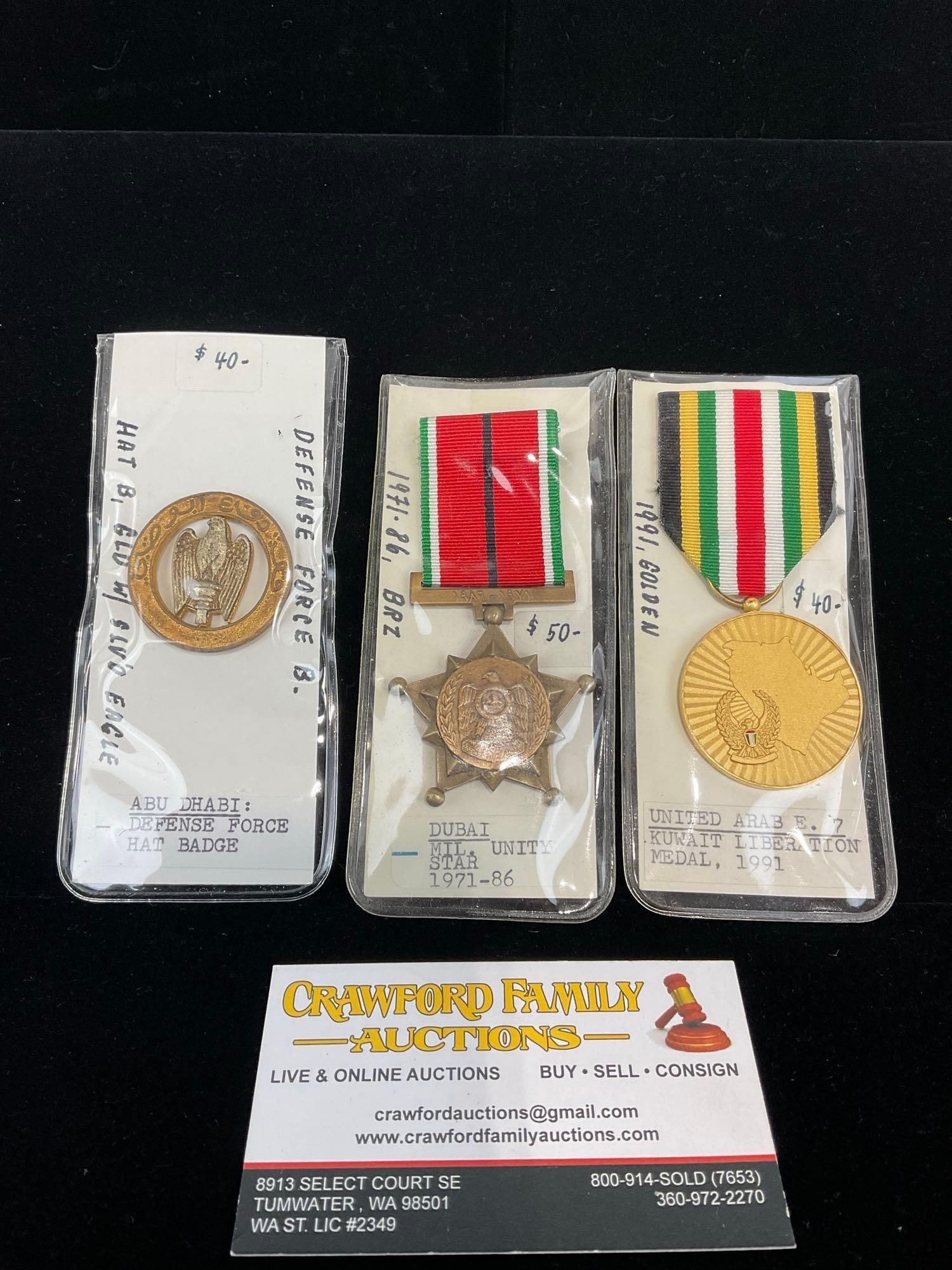 2 Medals, Dubai Mil Unity Star 71-86, UAE Kuwait Liberation Medal 1991 & Abu Dhabi Hat Badge Defe...: All from a single collection, these are briefly described on the tag and were kept in a display. They measure approx 6h x 3w x 2d inches. See pics. E-5300 