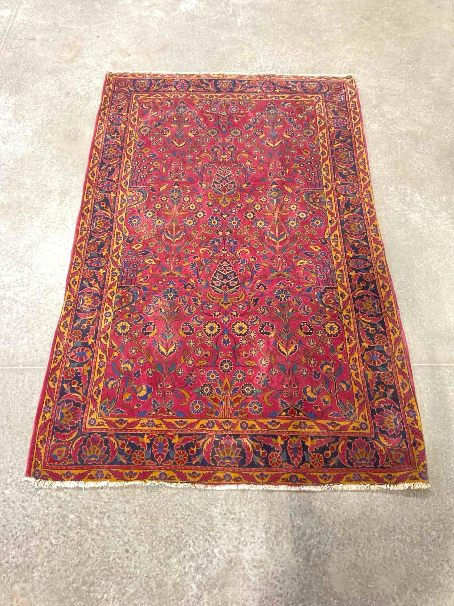 Vintage Persian Wine Red Wool Floor Rug w/ Gold Floral Design. Very Good Condition. See pics.: Vintage Persian Wine Red Wool Floor Rug w/ Gold Floral Design. Very Good Condition. Likely hand knotted. Minor wear, fringe is tired, condition is otherwise very good. Measures 86" x 55" DM-1554 