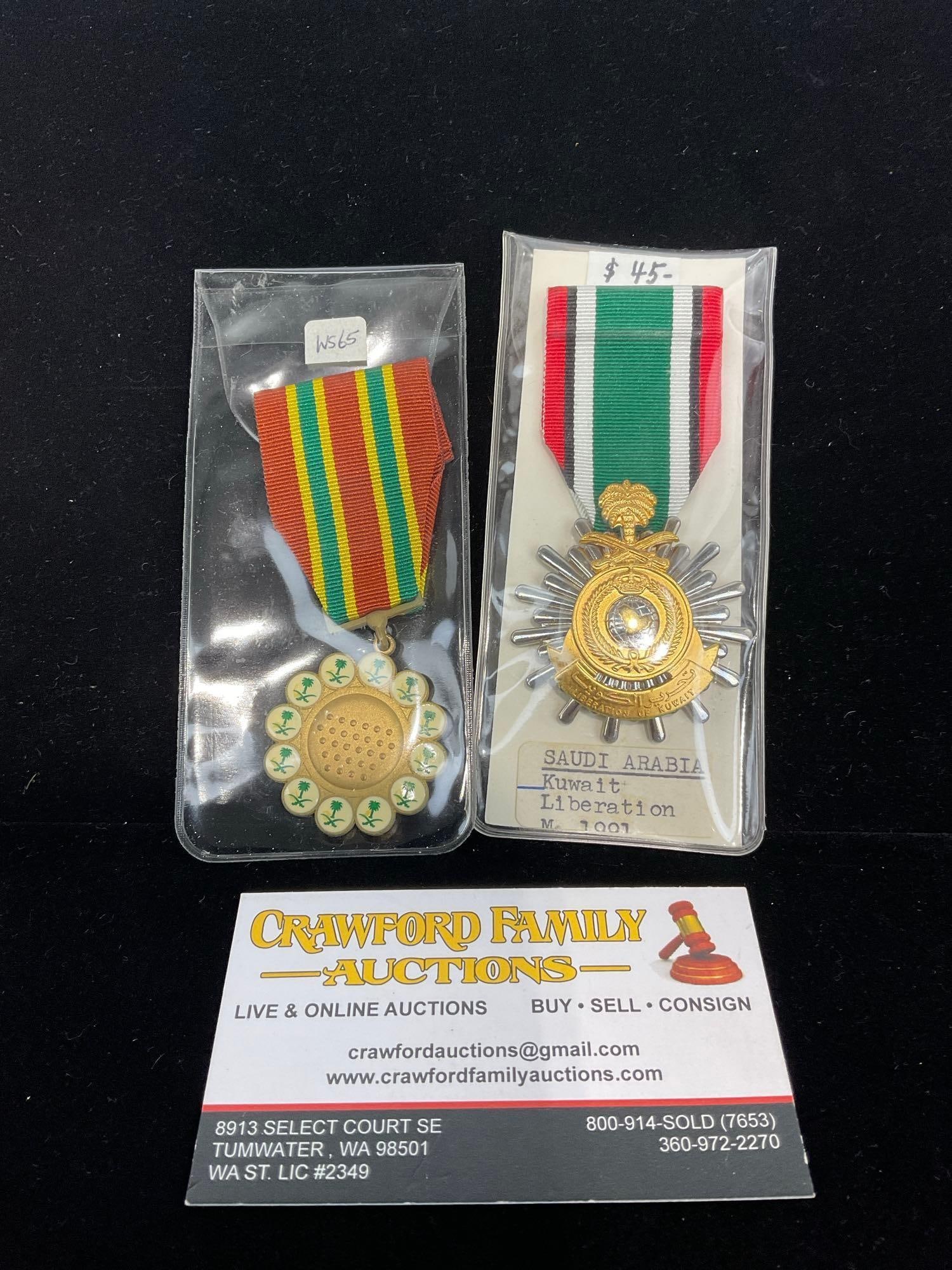 Pair of Saudi Arabia Medals, Kuwait Liberation 1991 & Combat Medal aka Nuth Al-Ma rkat, 1987: All from a single collection, these are briefly described on the tag and were kept in a display. They measure approx 6h x 3w x 2d inches. See pics. E-5300 