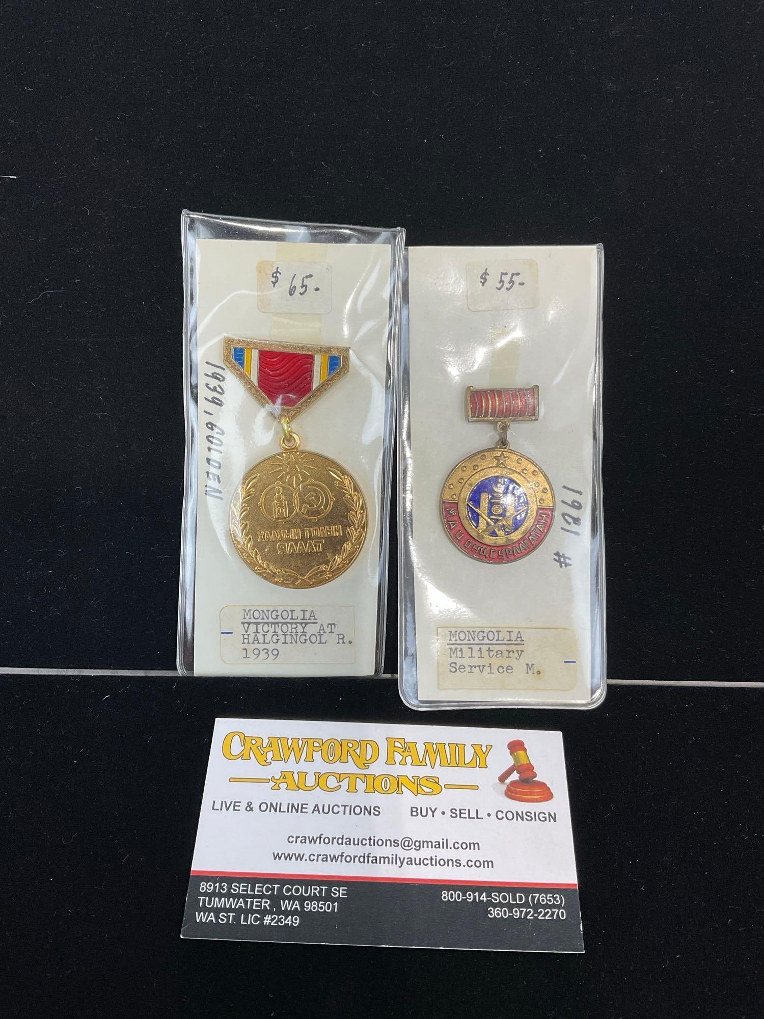 Pair of Mongolian Medals, Military Service Medal & Victory at Halgingol R. 1939: All from a single collection, these are briefly described on the tag and were kept in a display. They measure approx 6h x 3w x 2d inches. See pics. E-5300 