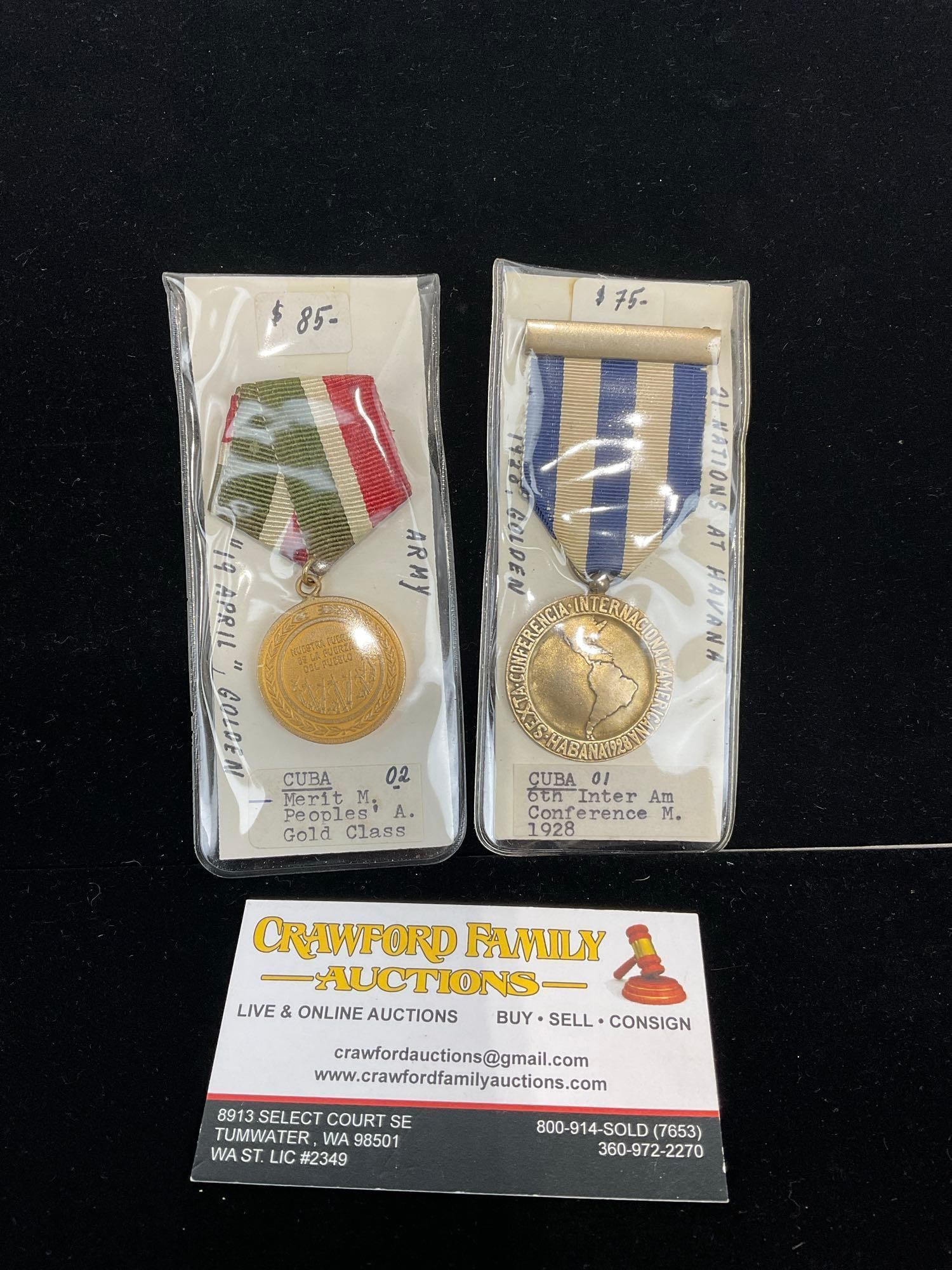 Pair of Cuban Medals, Merit Medal, Peoples Army 19 Abril & 1928 6th Inter American Conf. Medal: All from a single collection, these are briefly described on the tag and were kept in a display. They measure approx 6h x 3w x 2d inches. See pics. E-5300 