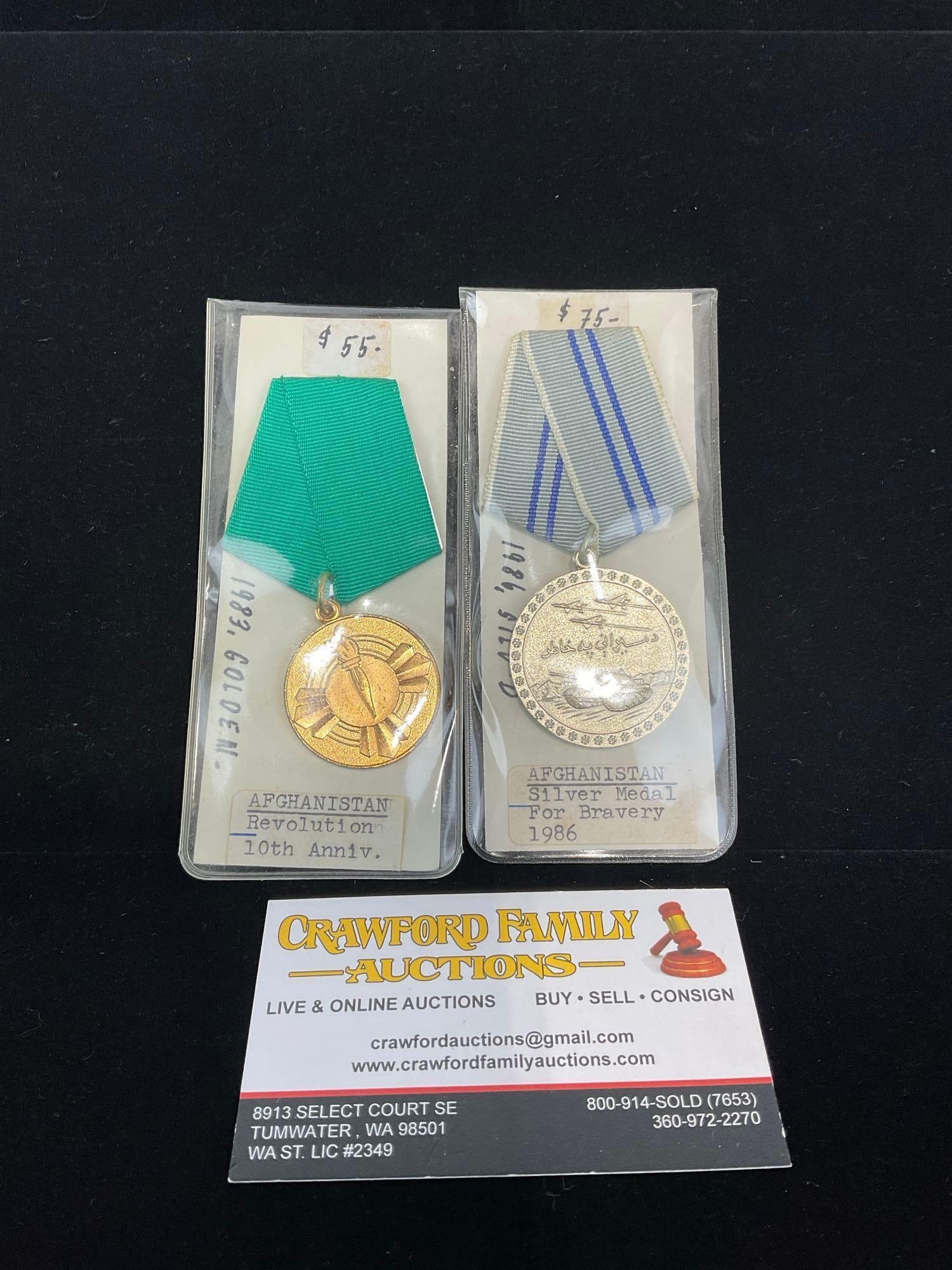 Pair of Afghanistan Medals, Revolution 10th Anniv. & Silver Medal for Bravery 1986: All from a single collection, these are briefly described on the tag and were kept in a display. They measure approx 6h x 3w x 2d inches. See pics. E-5300 