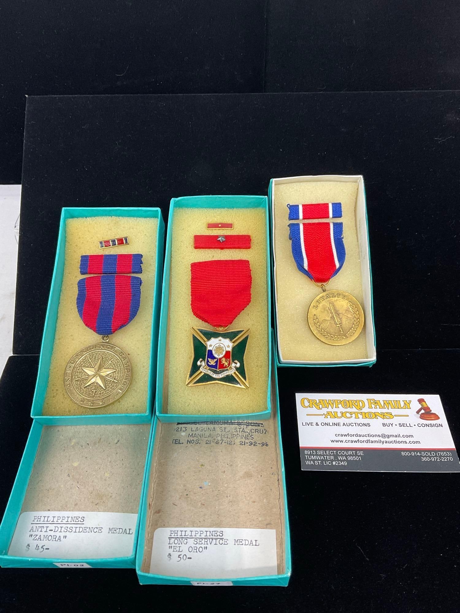 3 Philippines Medals, Anti-Dissidence Zamora, Long Service El Oro & Loyalty: All from a single collection, these are briefly described on the tag and were kept in a display. They measure approx 6h x 3w x 2d inches. See pics. E-5300