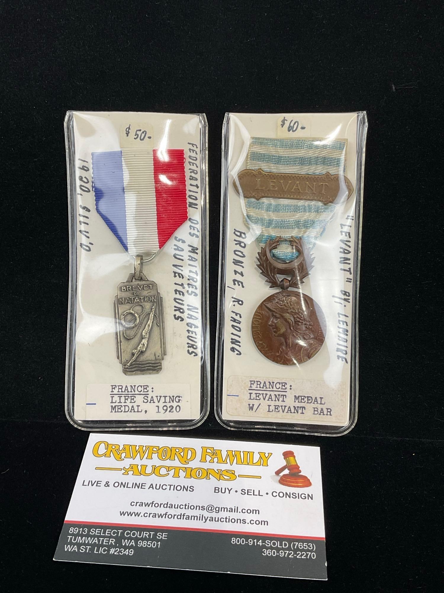 2x French Medals, Life Saving Medal 1920 & Levant Medal w/ Levant Bar, Bronze: All from a single collection, these are briefly described on the tag and were kept in a display. They measure approx 6h x 3w x 2d inches. See pics. E-5300 