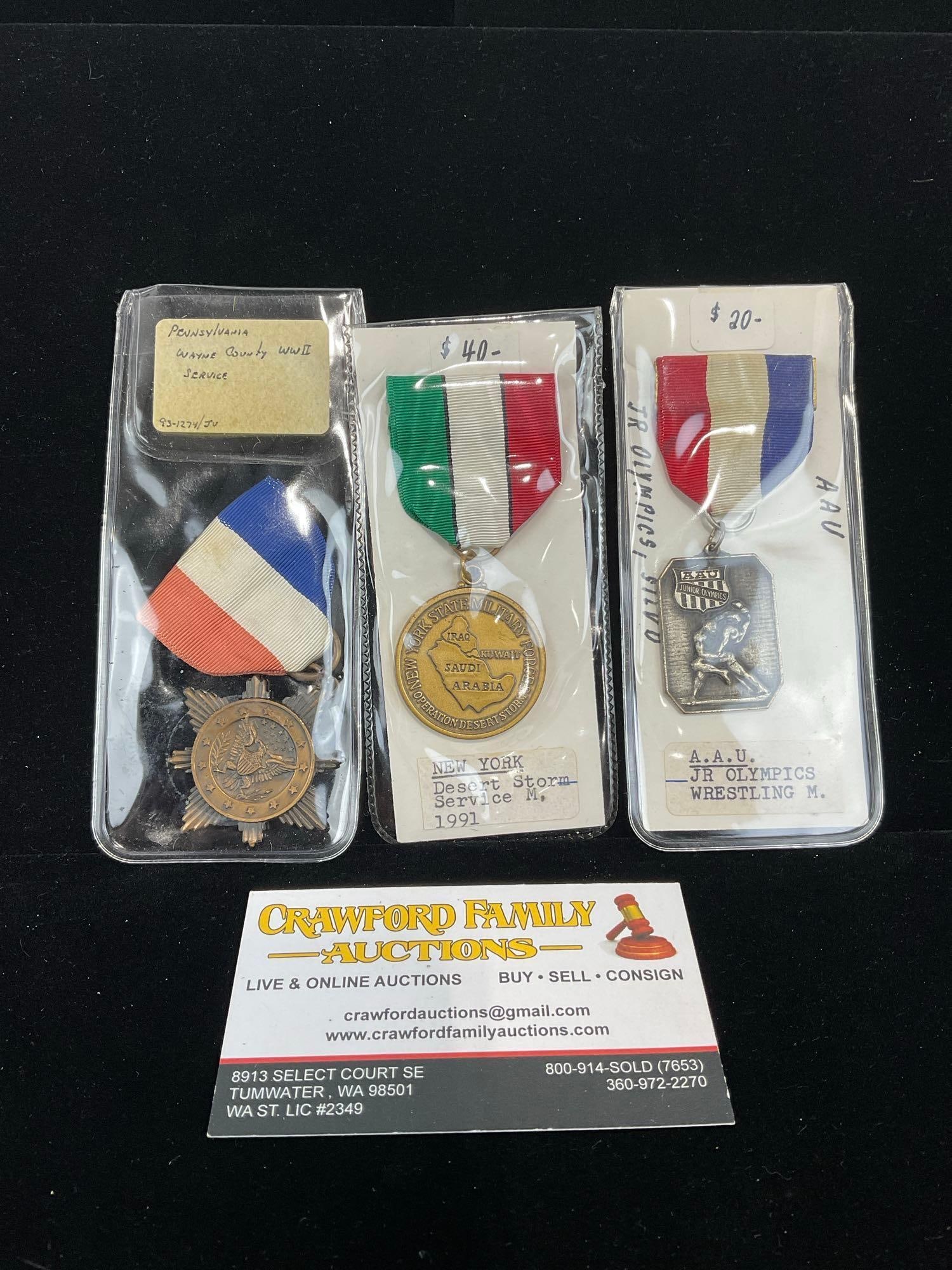 3 US Medals, Pennsylvania Wayne Country, New York Desert Storm Serv. & A.A.U. Jr Olympics Wrestling: All from a single collection, these are briefly described on the tag and were kept in a display. They measure approx 6h x 3w x 2d inches. See pics. E-5300