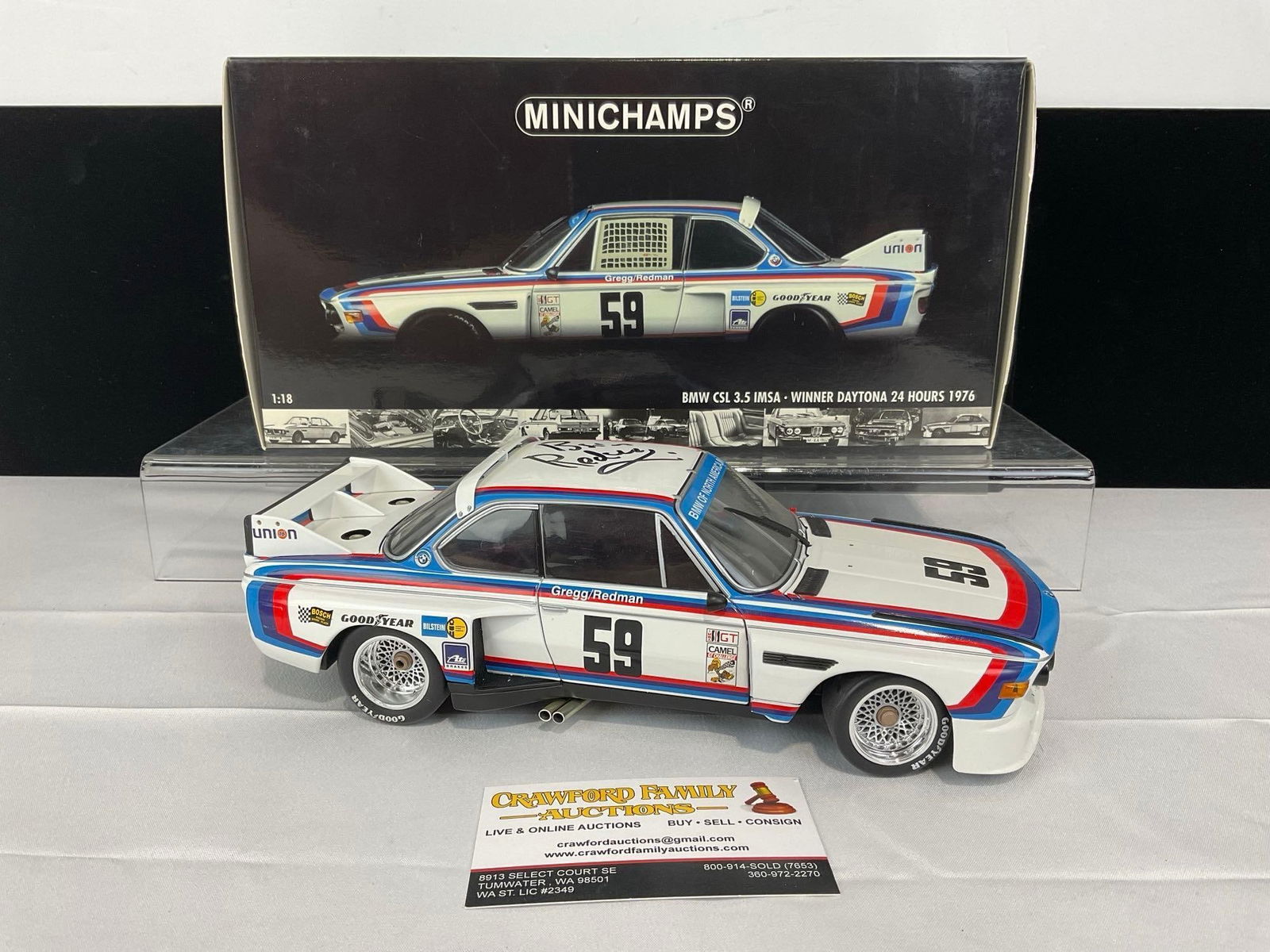 Minichamps 1976 BMW CSL 3.5 Daytona Signed by Brian Redman, 1/18 Scale Diecast Car Model orig box: Appears to be in good shape, the BMW sticker on the windshield has a break, and is loose. The piece measures approx 5h x 13w x 7d inches. See pics. E-5420