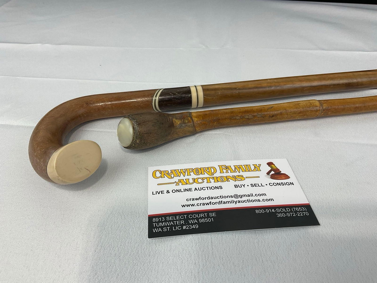 Pair of Walking Sticks, Curved Cane, Inlaid Bone & Dark Wood Motif, 1 w/MOP End Cap: Appears to be in good shape. The piece measures approx 37h x 6w x 3d inches. See pics. E-5490