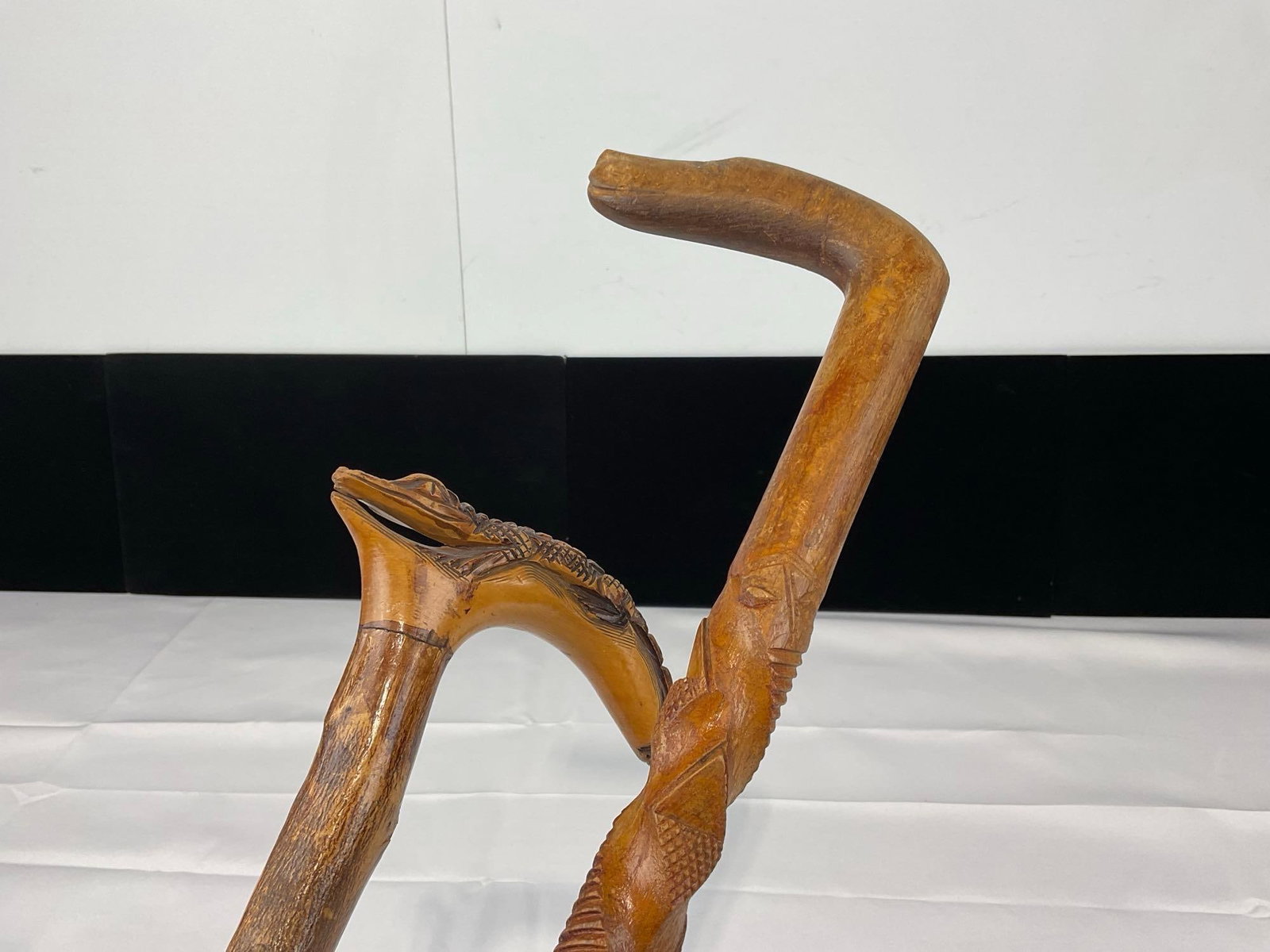 Pair of Carved Wooden Walking Sticks, Caiman Alligator Handle, & Textured Cane, 36h x 6w x 3d inc...: Appears to be in good shape. The piece measures approx 36h x 6w x 3d inches. See pics. E-5490