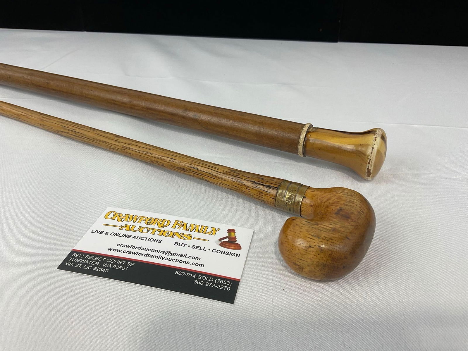 Pair of Wooden Walking Sticks, 36h x 4w x 3d inches: Appears to be in good shape. The piece measures approx 36h x 4w x 3d inches. See pics. E-5490