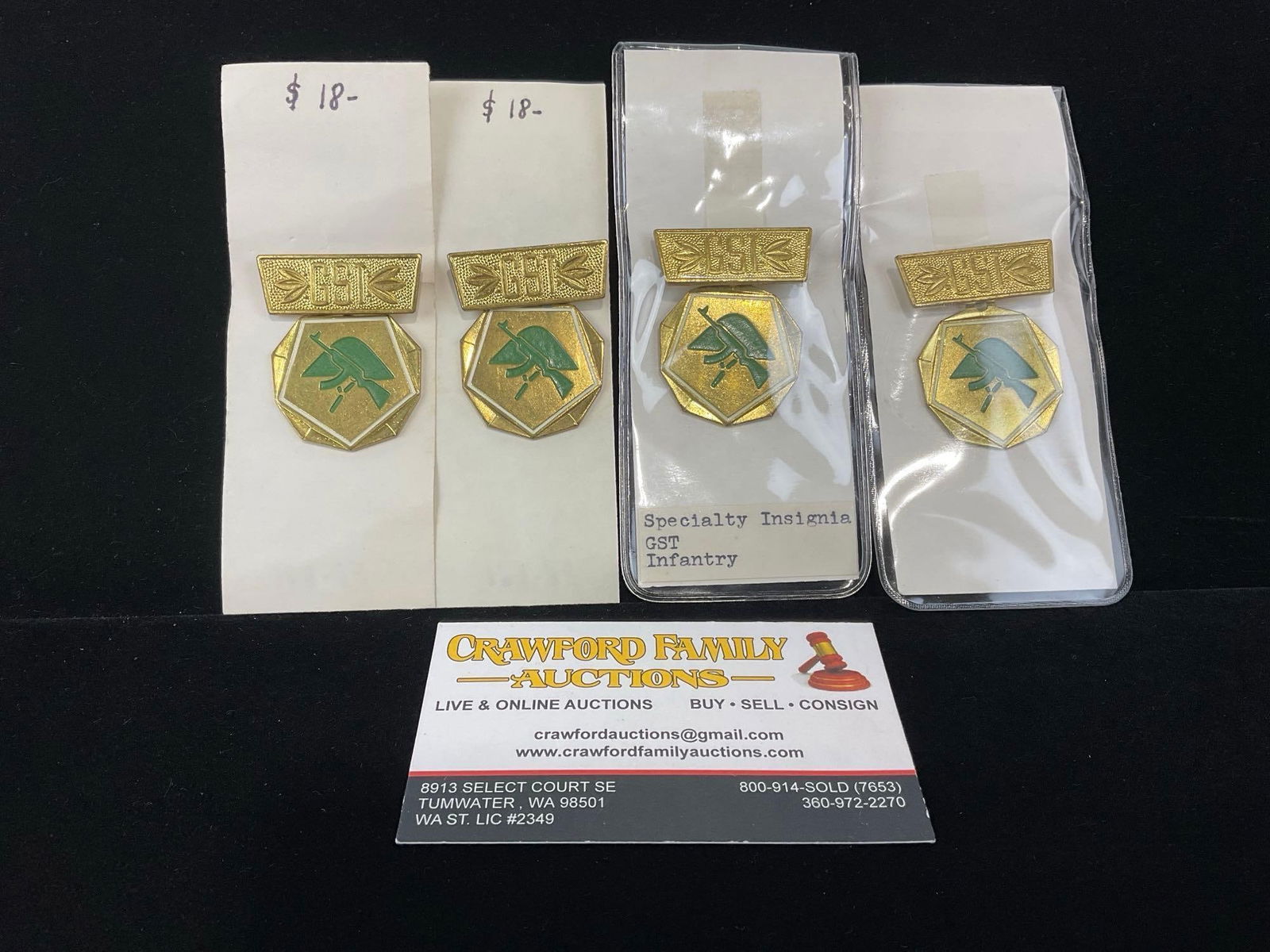 4 GDR East German GST Infantry Specialty Insignia Badges, gold tone metal w/ Green Enamel: All from a single collection, these are briefly described on the tag and were kept in a display. They measure approx 6h x 3w x 2d inches. See pics. E-5300 
