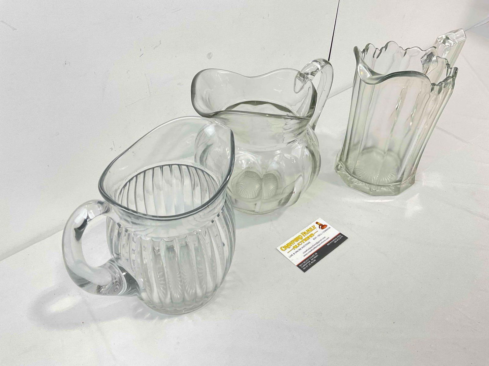 3 pcs Vintage Clear Glass Water Pitchers. Very Good Condition. Measures 9" x 5" x 9" See pics. - 3