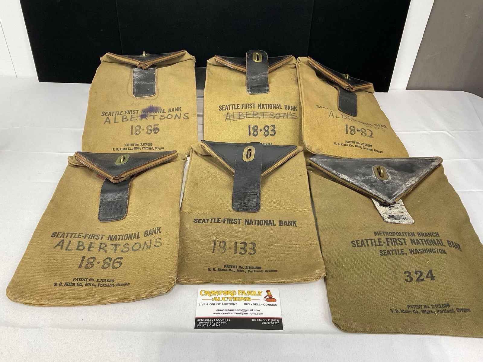 6x Old Seattle First National Bank Bags, w/ Brass Rings, Tough material, w/reinforced Leather Flaps: Appears to be in fair shape, one with significant weathering, varied levels of wear. The pieces together measures approx 6h x 9w x 10d inches. See pics. E-5360 