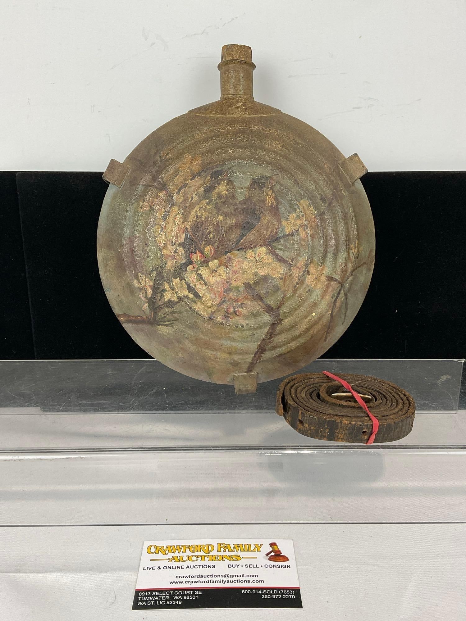 Antique 1860s Civil War Canteen, w/Leather Strap, Wood Cork, Handpainted w/ Birds on Branch Scene: Appears to be in fair to good shape. The piece measures approx 10h x 9w x 5d inches. See pics. E-5360 