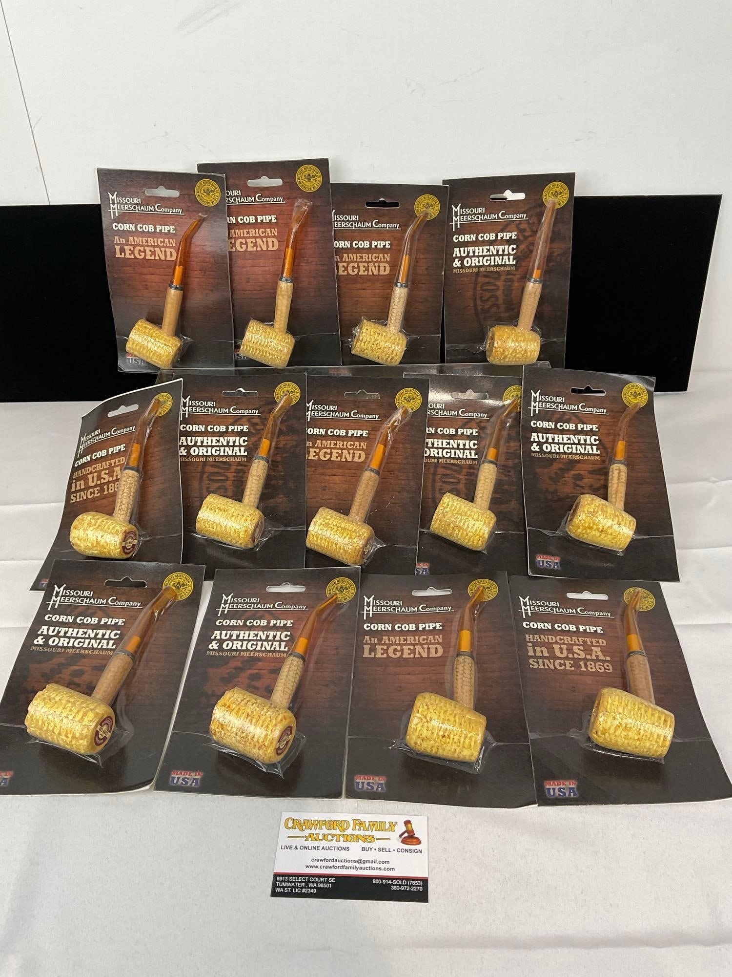 13 Missouri Meerschaum Co Corn Cob Pipes, in packaging, Bent Stems: Appears to be in good shape. The piece measures approx 5h x 14w x 10d inches. See pics. E-5430 