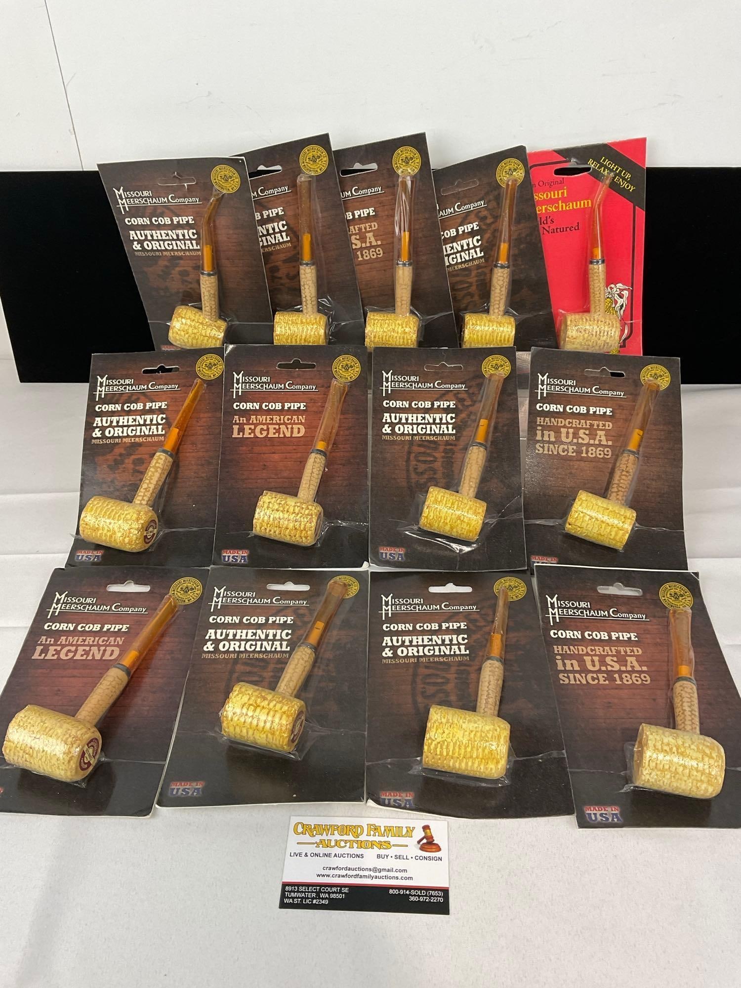13 Missouri Meerschaum Co Corn Cob Pipes, in packaging, Straight Stems: Similar to the next few lots. Appears to be in good shape. The piece measures approx 8h x 11w x 9d inches. See pics. E-5430 