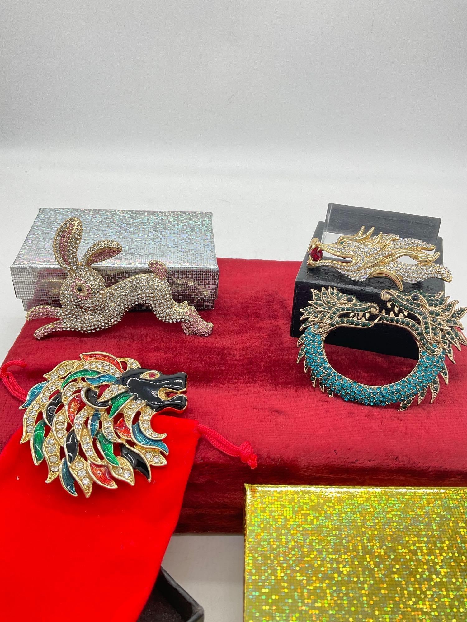 Nice set of Gold tone enamel and Crystal Brooches 2x Dragon 1 X Mulit Colored Lion Head 1x rabbit: c-5280 All Are 2 to 3" In presentation boxes 