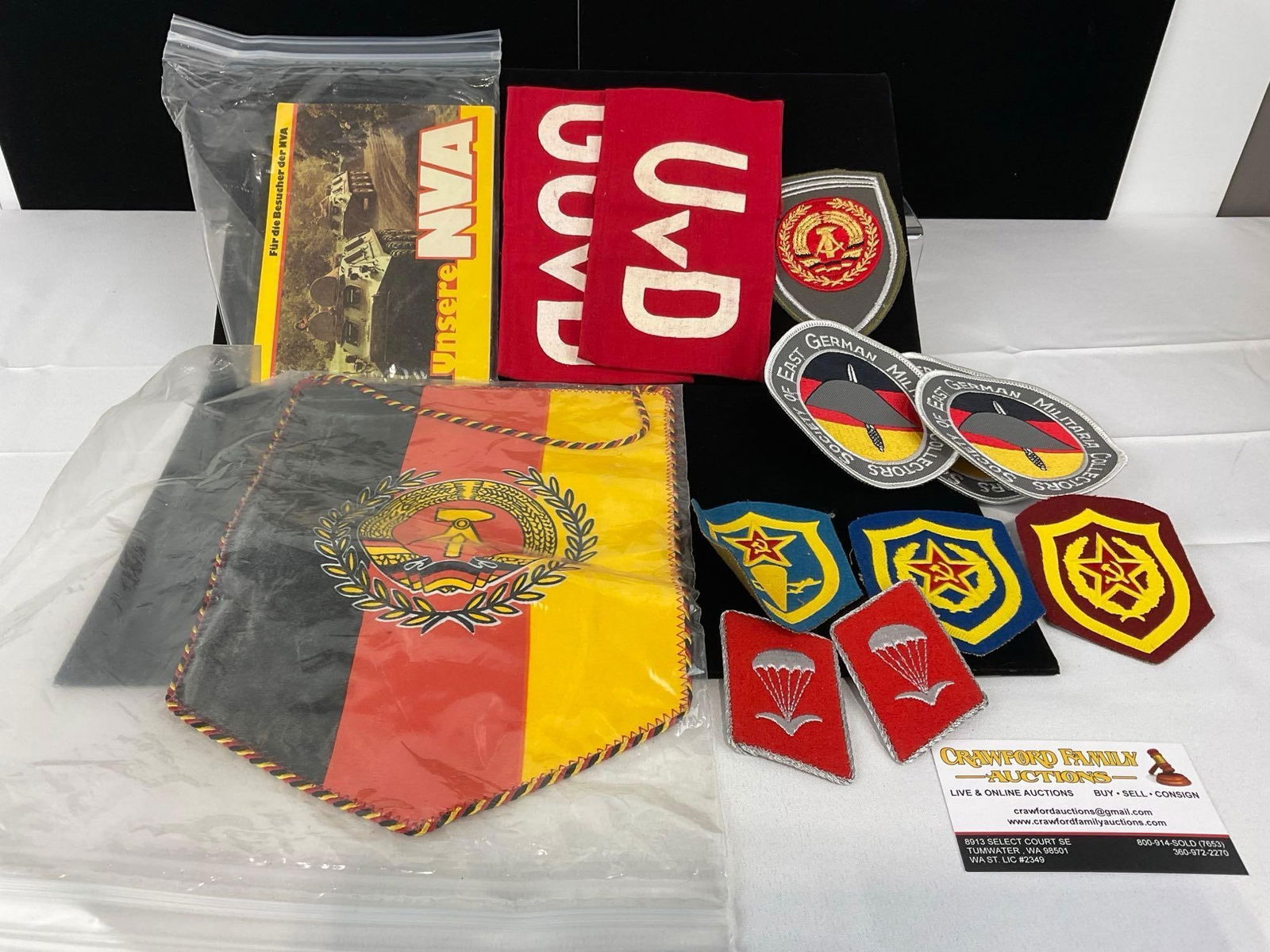 Assortment of GDR East German Flag, Armbands, Brochure, GDR & USSR Patches: All from a single collection, these are briefly described on the tag and were kept in a display. They measure approx 8h x 5w x 2d inches. See pics. E-5300 